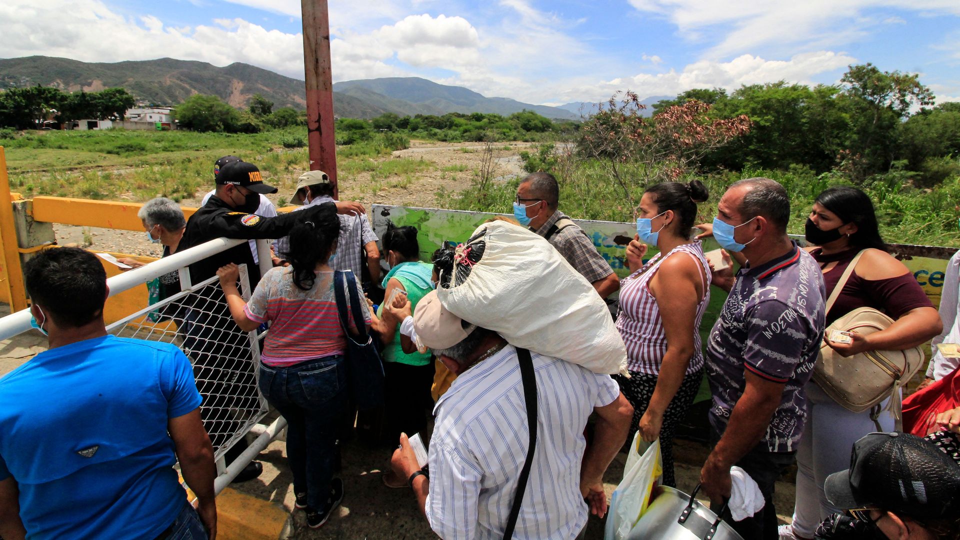  Venezuelan people at the Venezuela-Colombia border  on Monday, as officials prepare to remove containers that were placed as barricades between the two countries in 2019.