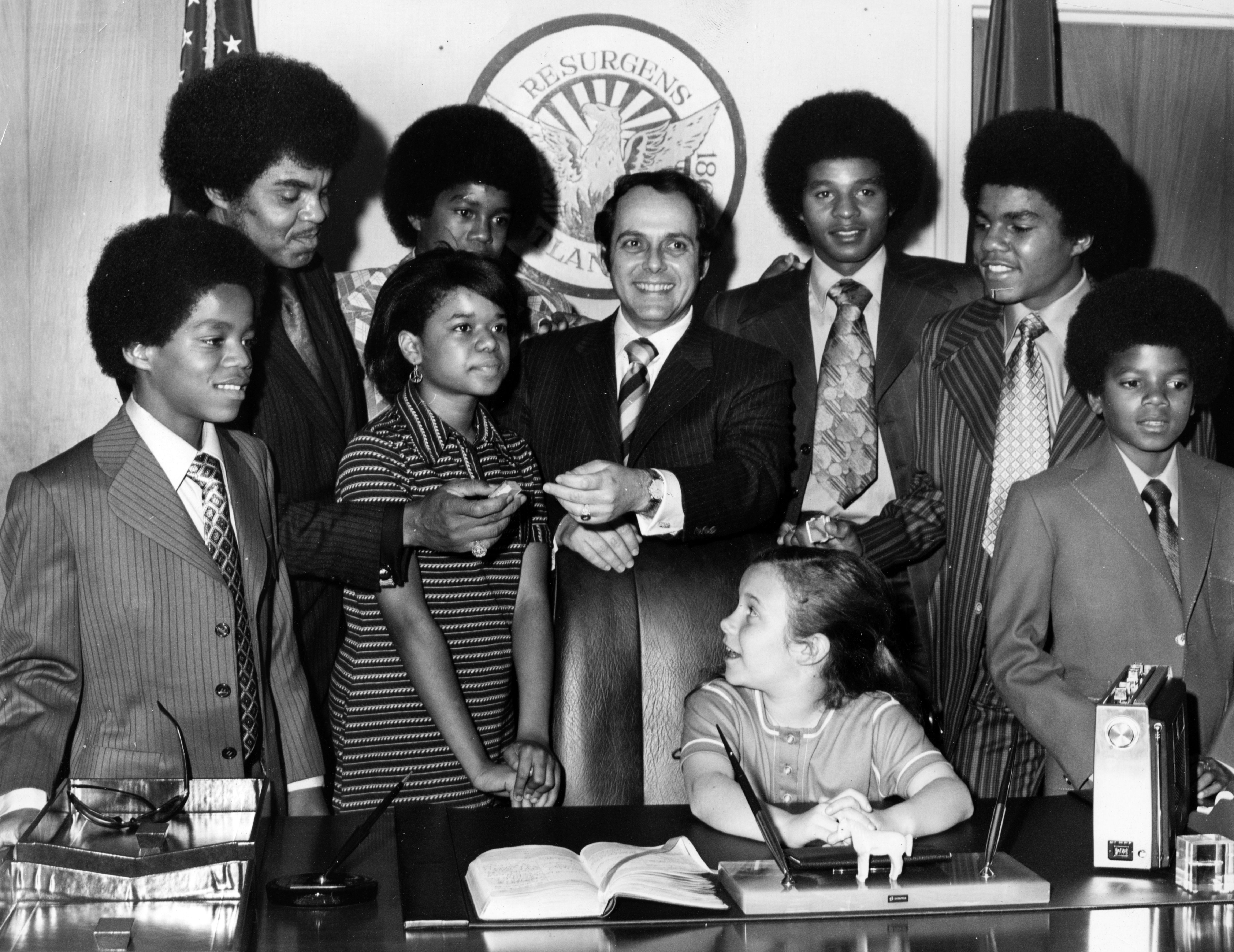 Marlon Jackson, Joseph Jackson, Azira Hill, Jermaine Jackson, Mayor Sam Massell, Jackie, Tito and Michael Jackson stand while the Mayor's daughter Melanie looks up admiringly over her shoulder, Atlanta, Georgia, April 7, 1971. (Photo by Afro American News