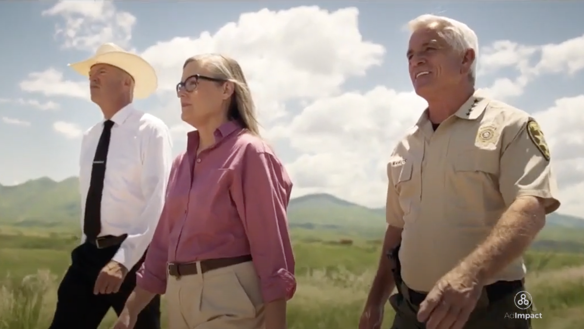 Katie Hobbs and Arizona sheriffs David Hathaway and Chris Nanos walk alongside each other