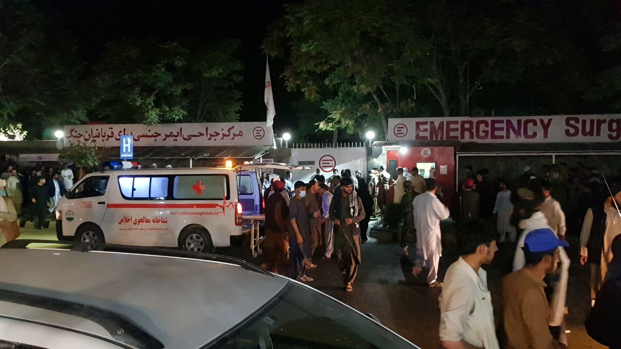 Injured people being carried to a hospital as unspecified number of casualties reported after two explosions outside Hamid Karzai International Airport in Kabul, Afghanistan