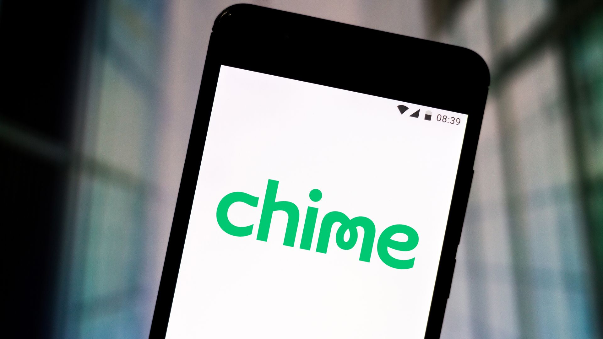 Chime mobile banking logo on a smartphone.