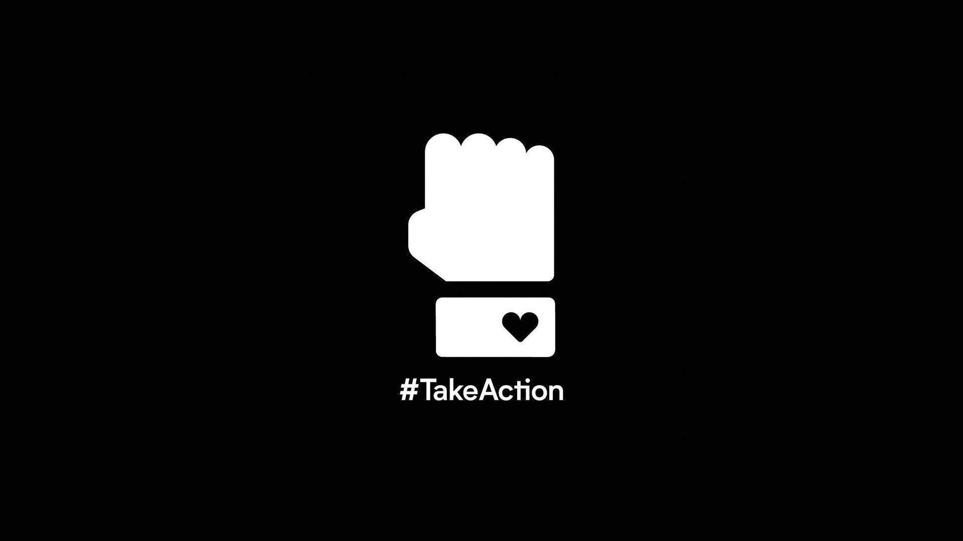 Screenshot of a white on black image of an upraised hand over a message box with a heart in it and the hashtag "#TakeAction"