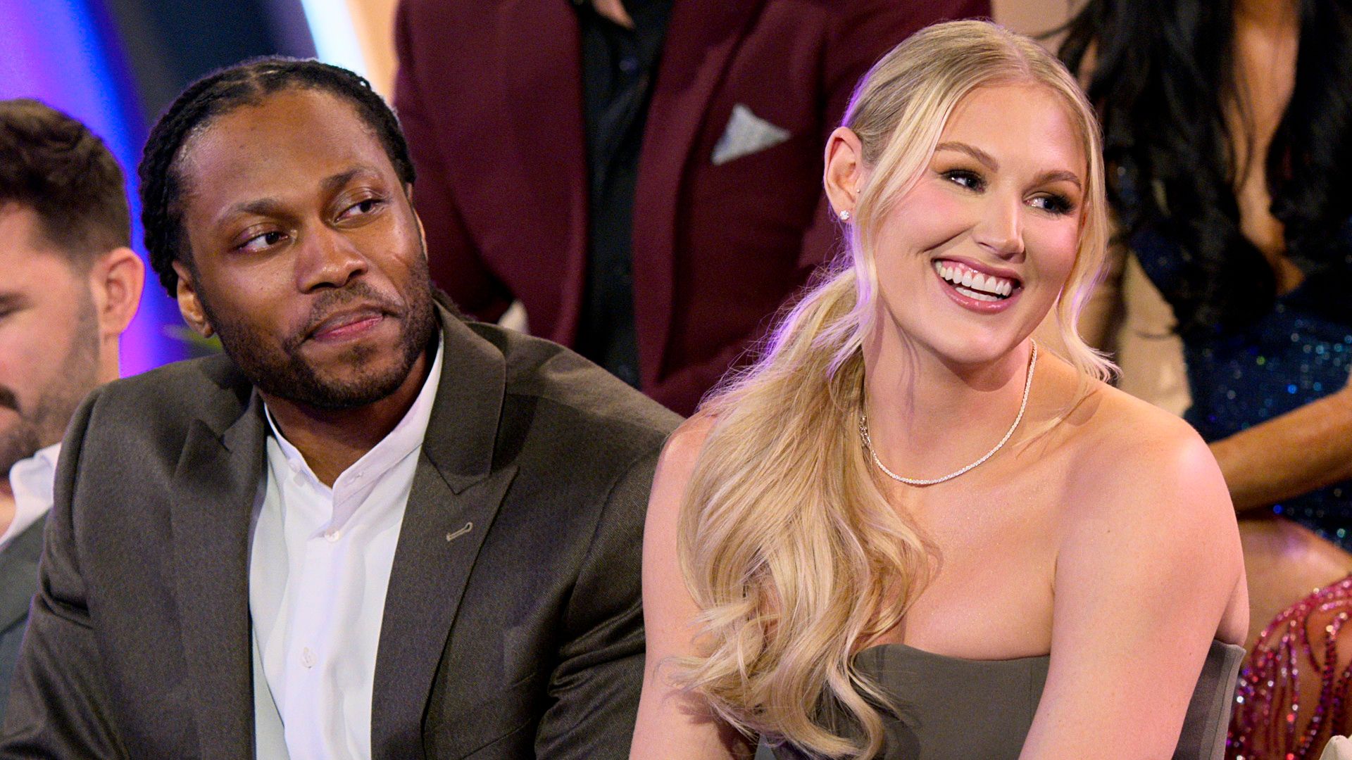 Ohio State professor Victor St. John and speech pathologist Christine Hamilton smiling on stage during last night's "Love is Blind" reunion. 