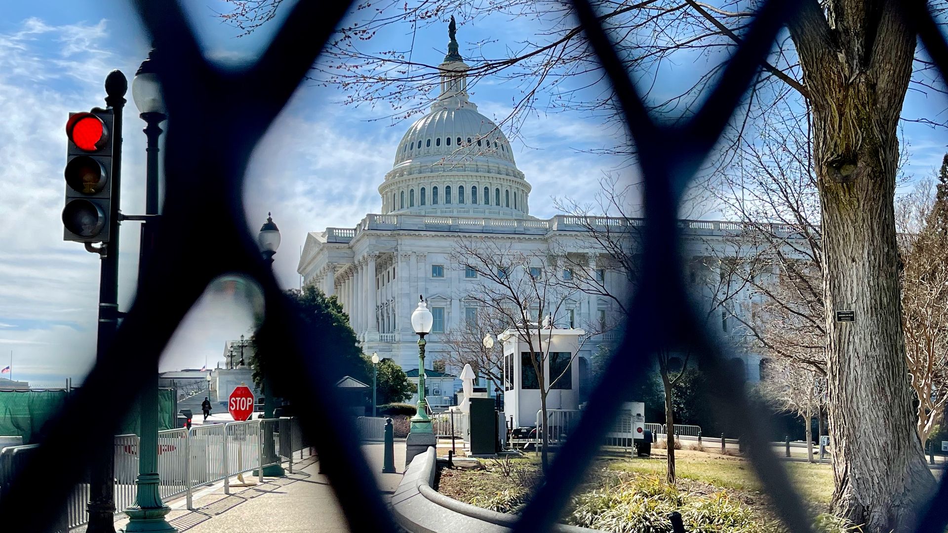 A photo shows newly reinstalled fencing around the U.S. Capitol.