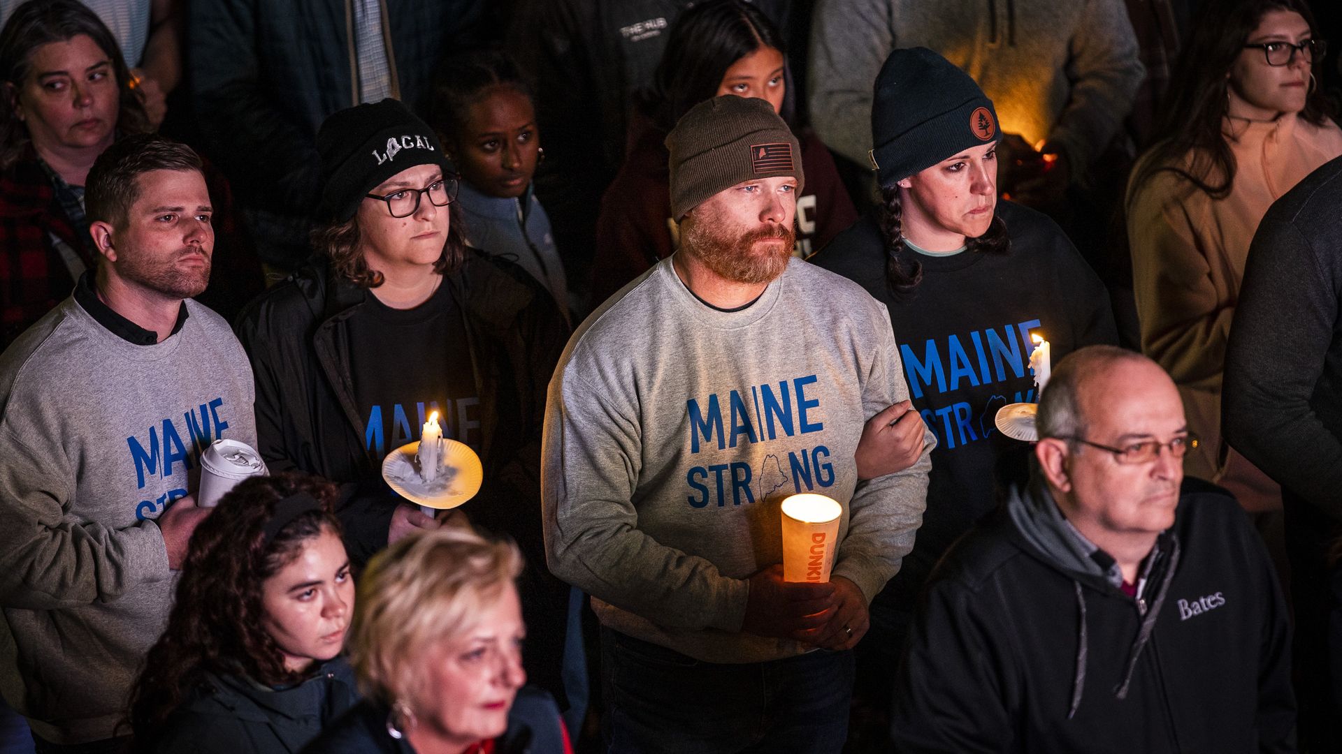 Hundreds spilled outside of the Basilica of Saints Peter and Paul while attending a vigil for the 18 people who were killed in Lewiston's mass shootings