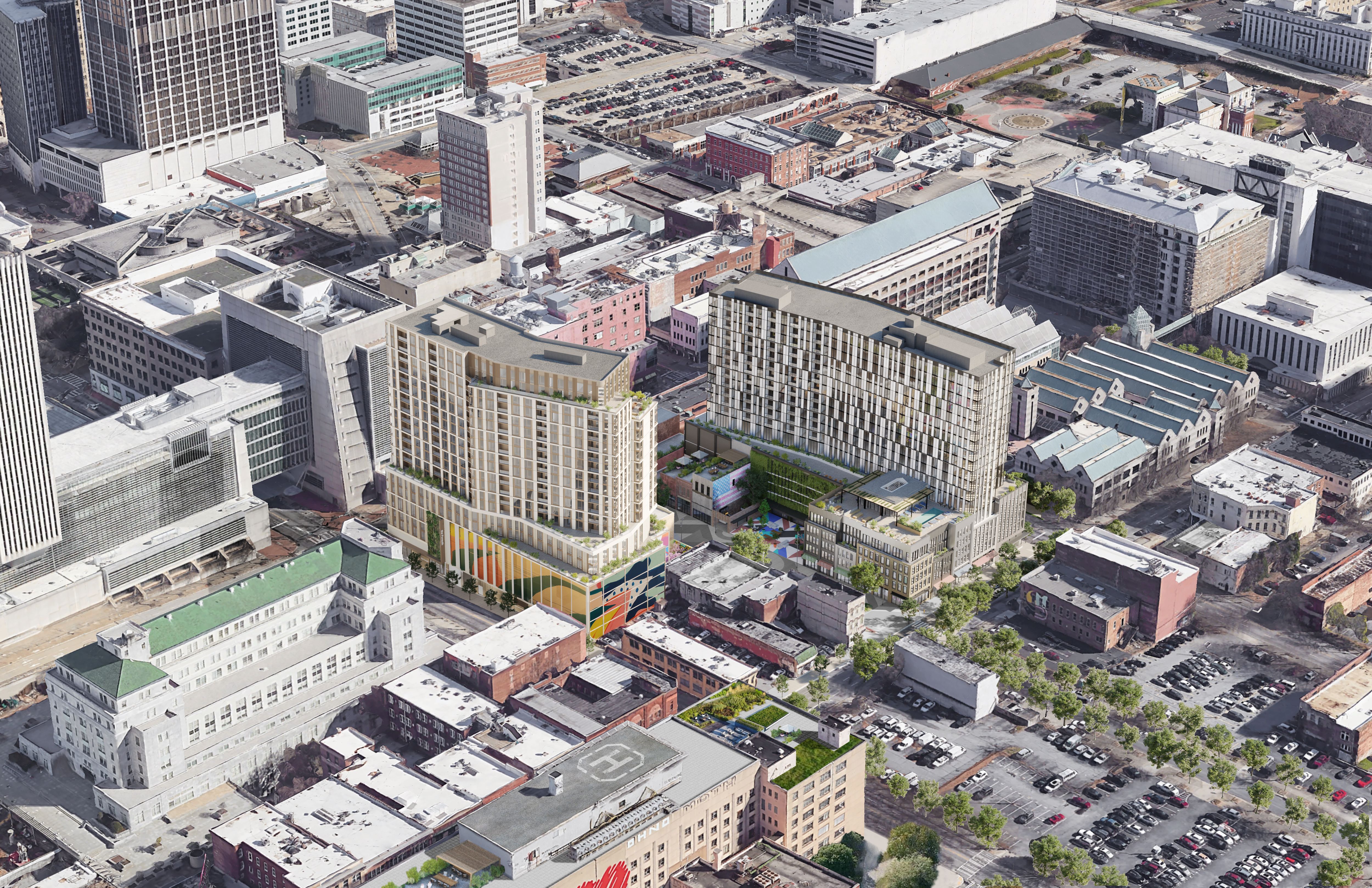An aerial rendering of two new tall residential buildings in South Downtown surrounded by mid-rise historic buildings