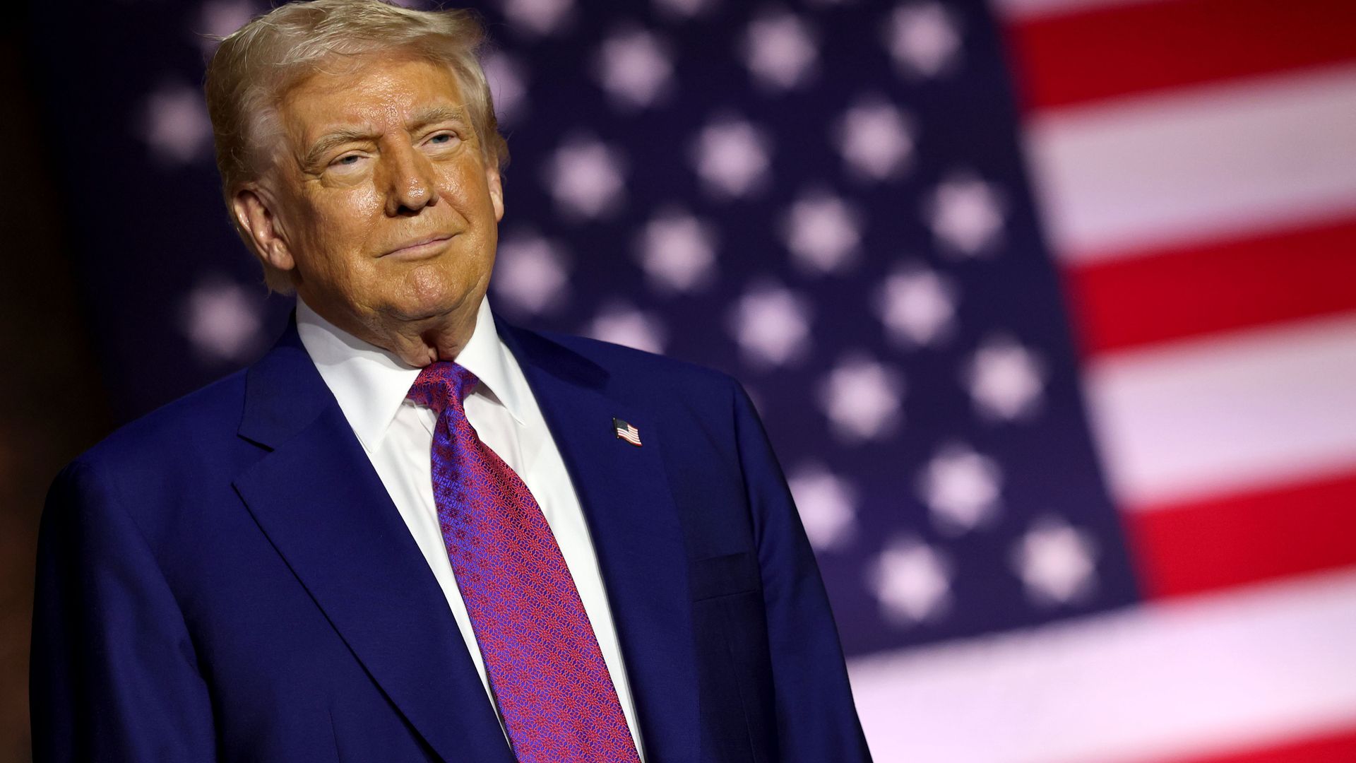 U.S. President Donald J. Trump stands on stage as he tours the Al Udeid Air Base on May 15, 2025.