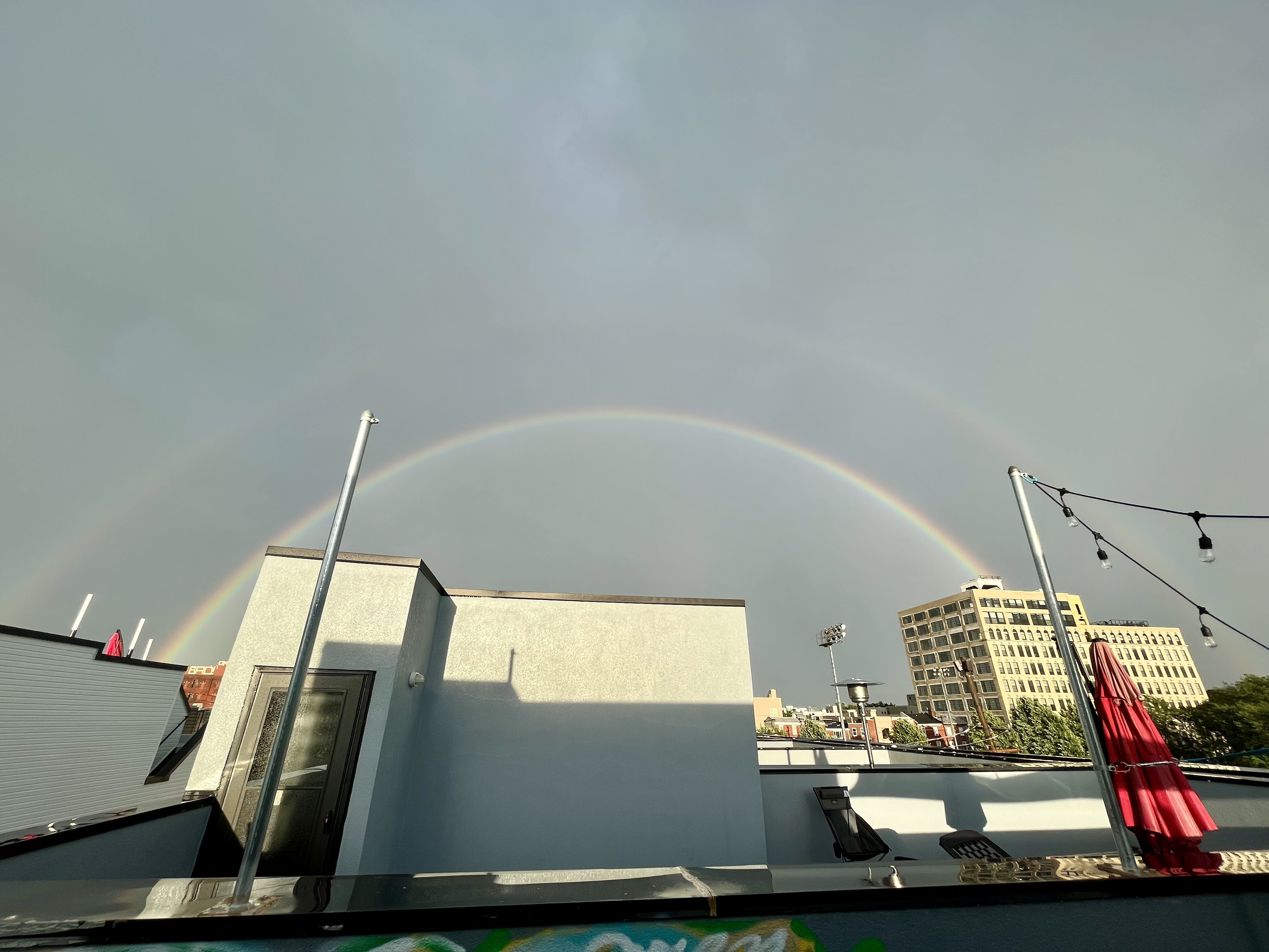 View of double rainbow from a Philly roof deck. 