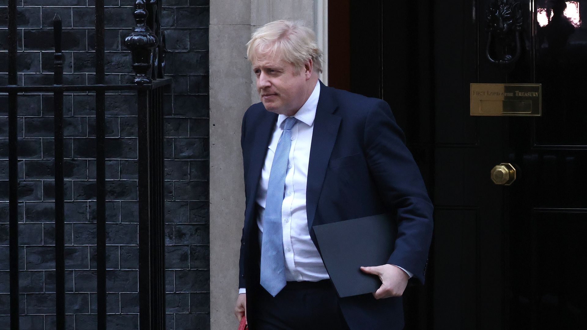 Prime Minister Boris Johnson leaves 10 Downing Street to make a statement at Parliament on January 31