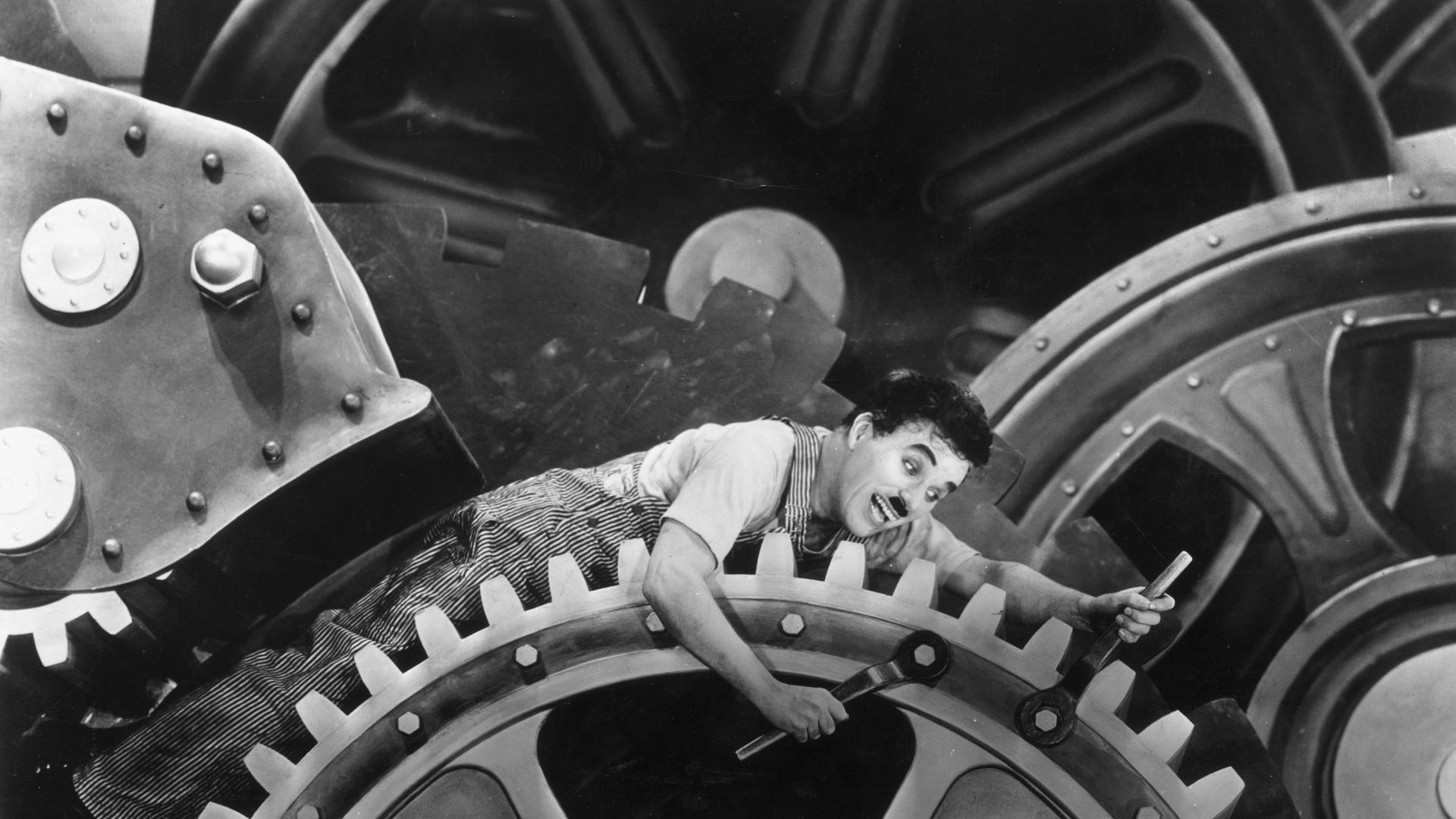 Charlie Chaplin's The Tramp inside a machine.