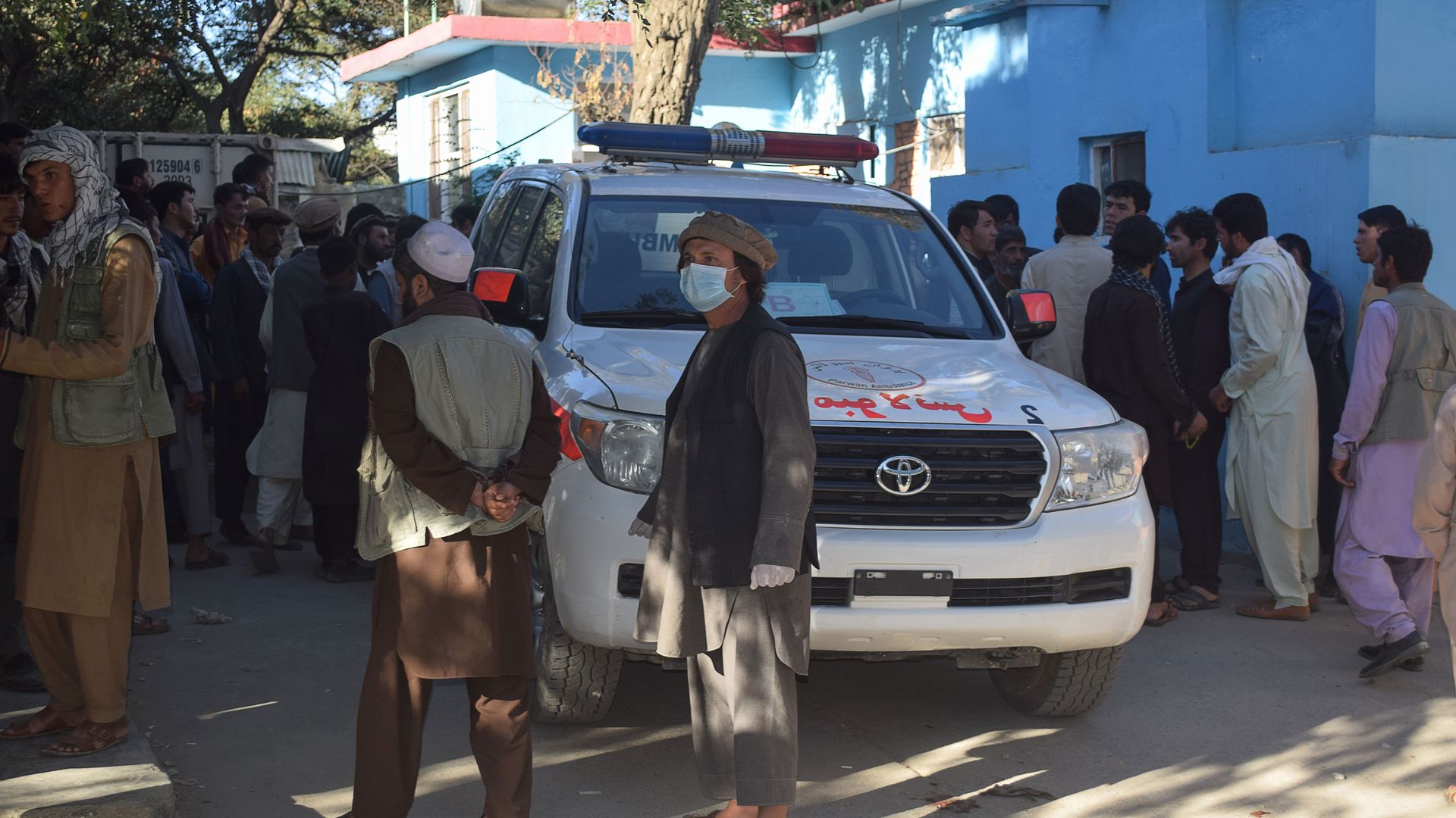 Relatives wait outside of a hospital in Afghanistan after a Taliban attack