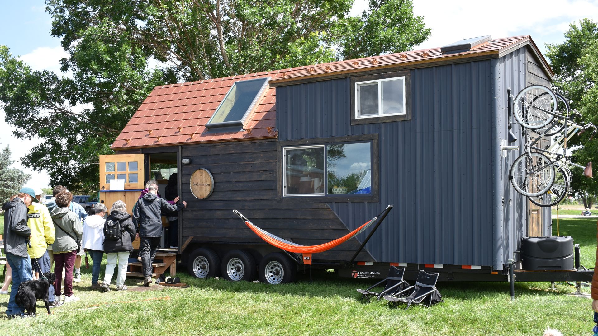 Visitors touring a tiny home at the Colorado Tiny Home Festival