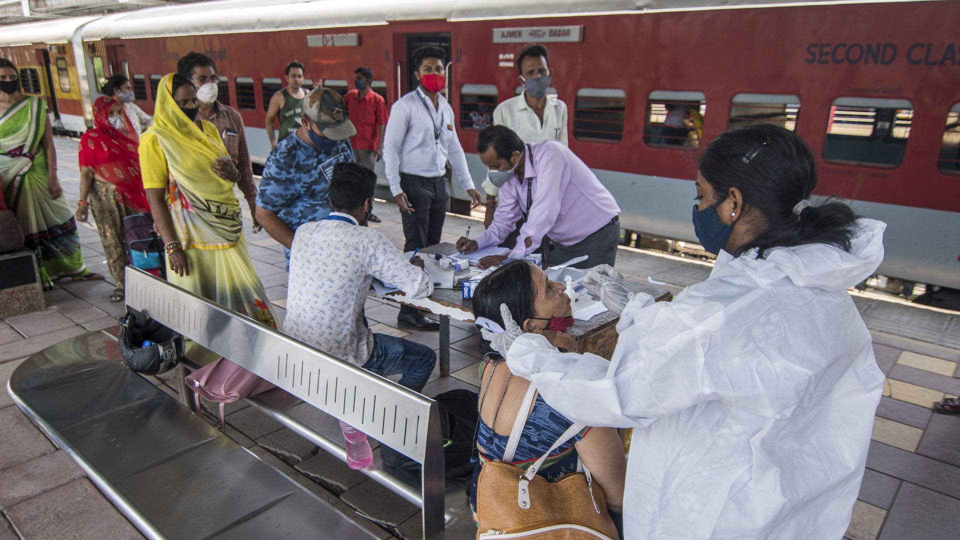 Healthcare workers conducting COVID-19 tests in Mumbai on May 6, 2021.