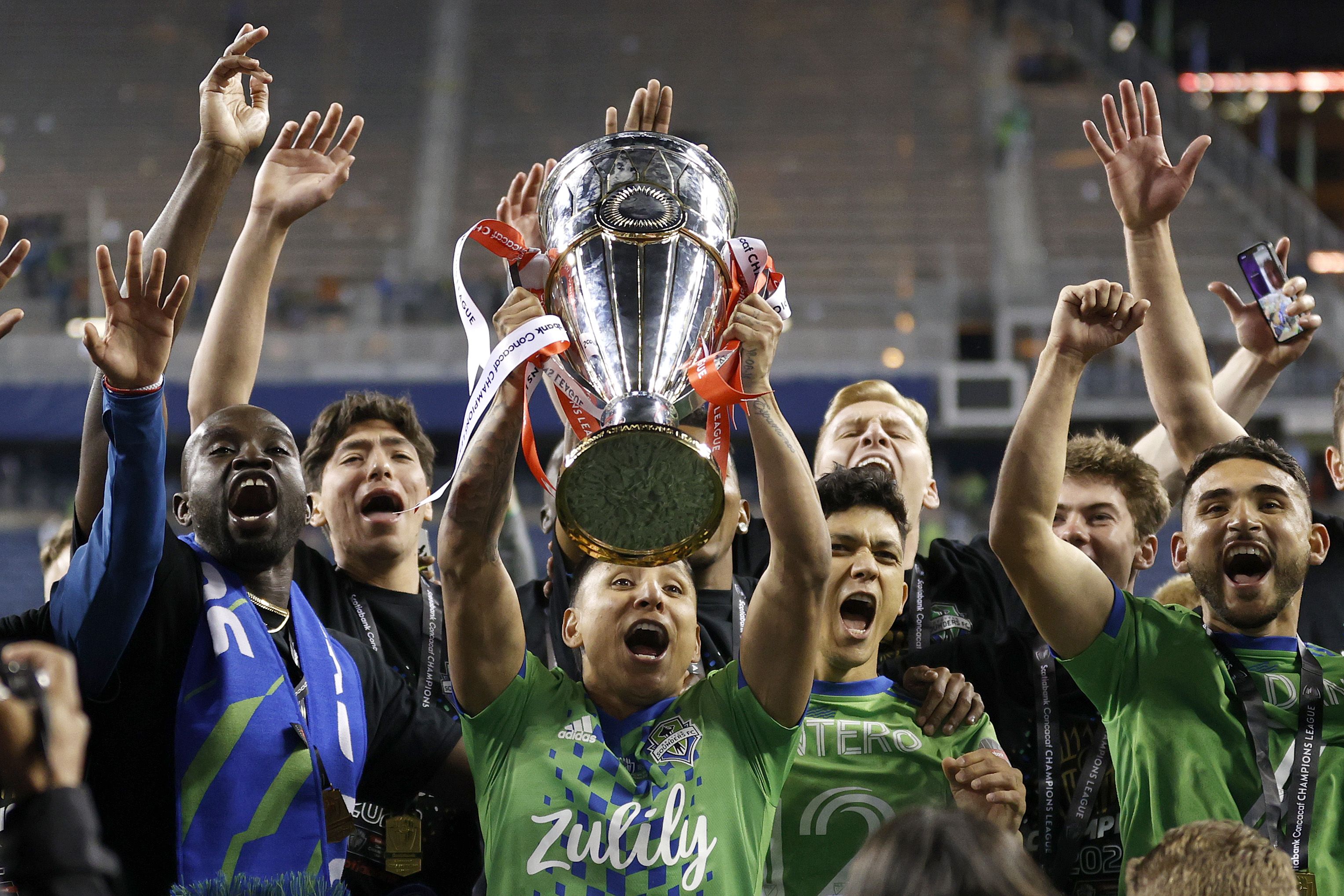sounders hoisting trophy