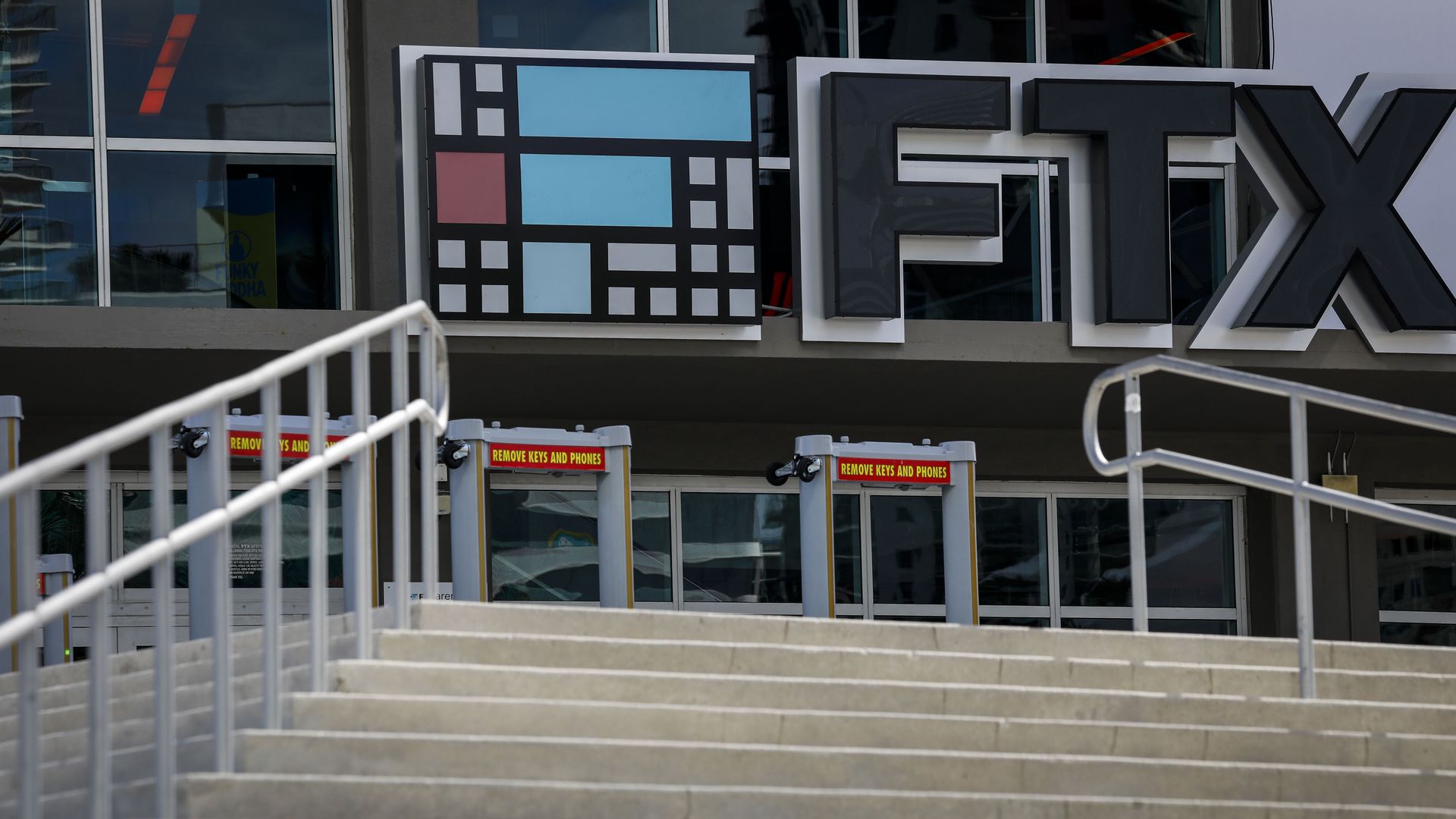 A sign saying FTX is above glass doors at the Miami Heat's arena 