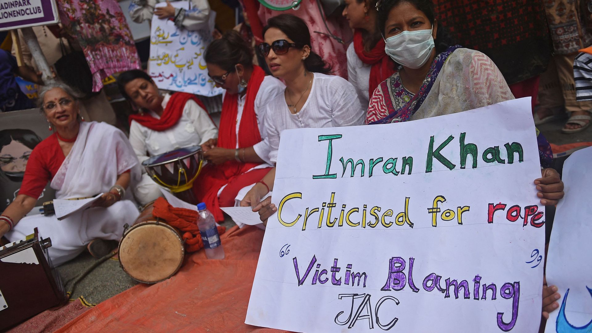 Civil society activists take part in a demonstration in Karachi on June 26, 2021 protesting against Pakistan Prime Minister's comments.