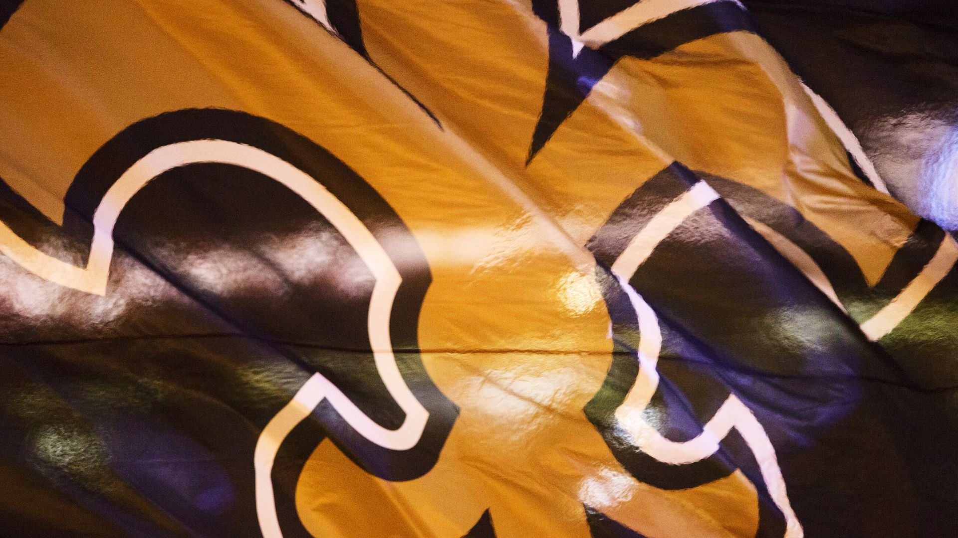 New Orleans Saints logo on a flag
