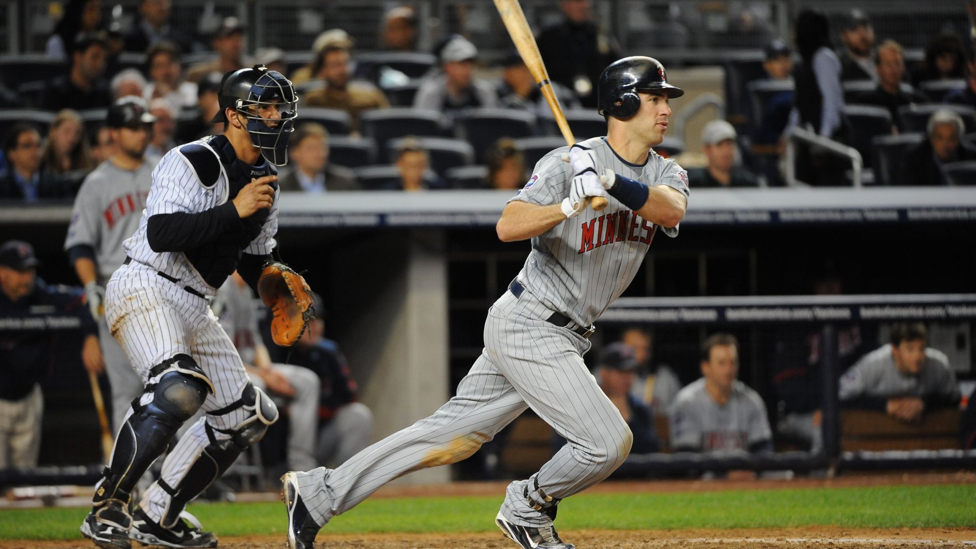 Joe Mauer swings a bat 