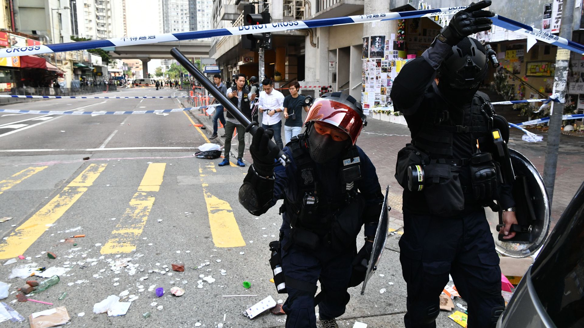 Policeman cordon off the site where a pro-democracy protesters was shot by a policeman in Hong Kong on November 11