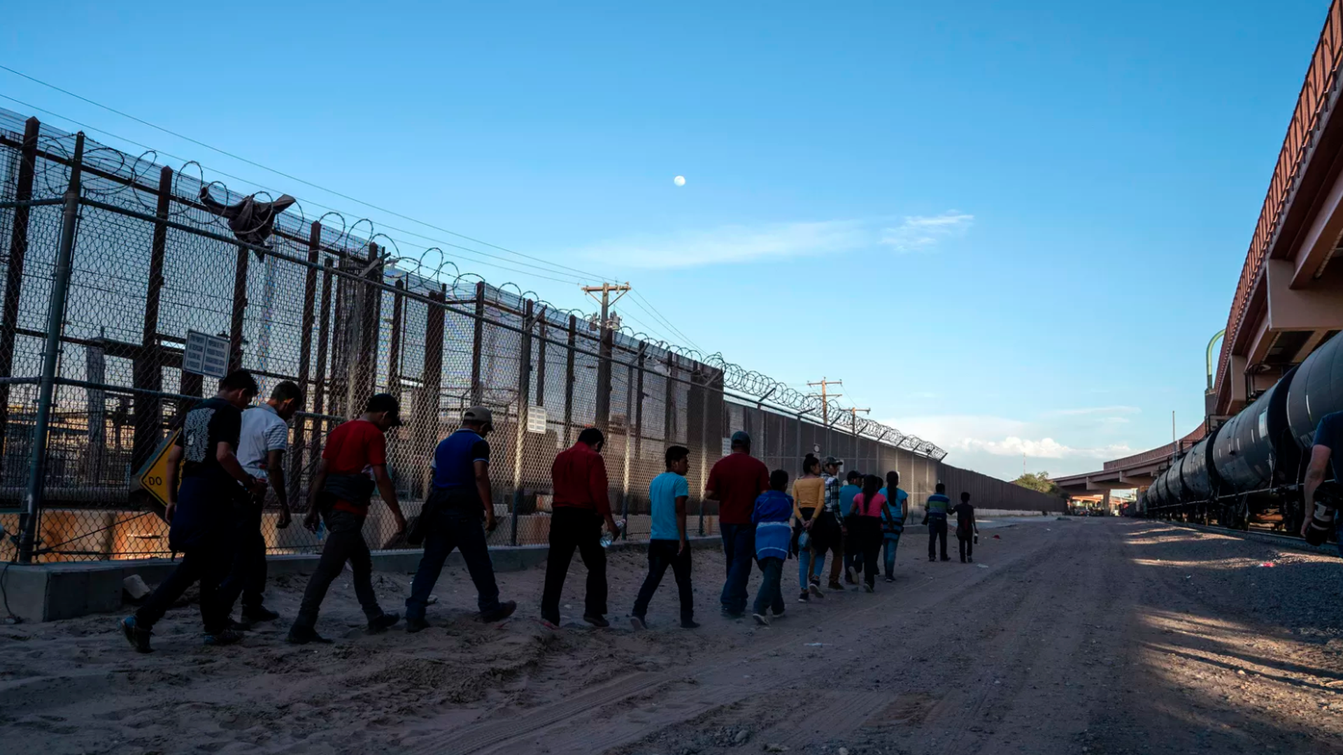 Immigrants, mostly from Central America, travel toward an immigration processing center in El Paso, Texas. Photo: Paul Ratje/AFP/Getty Images