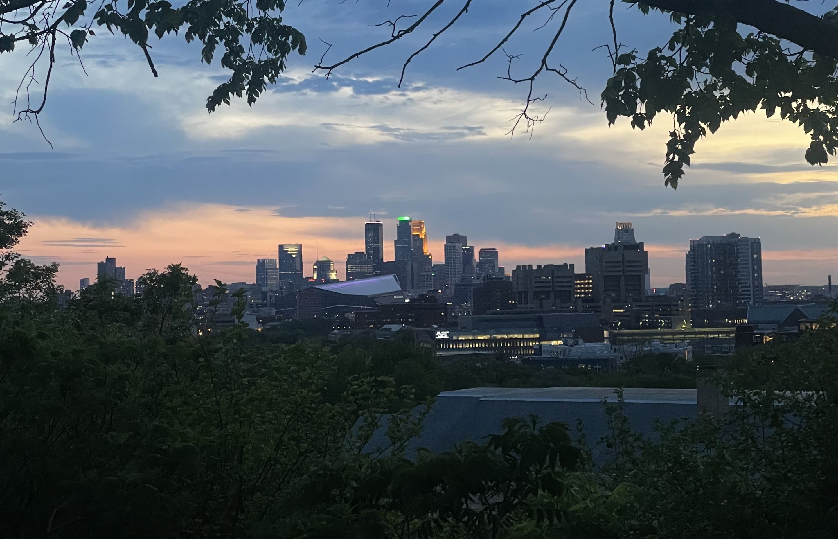 The view of the Minneapolis skyline at sunset.
