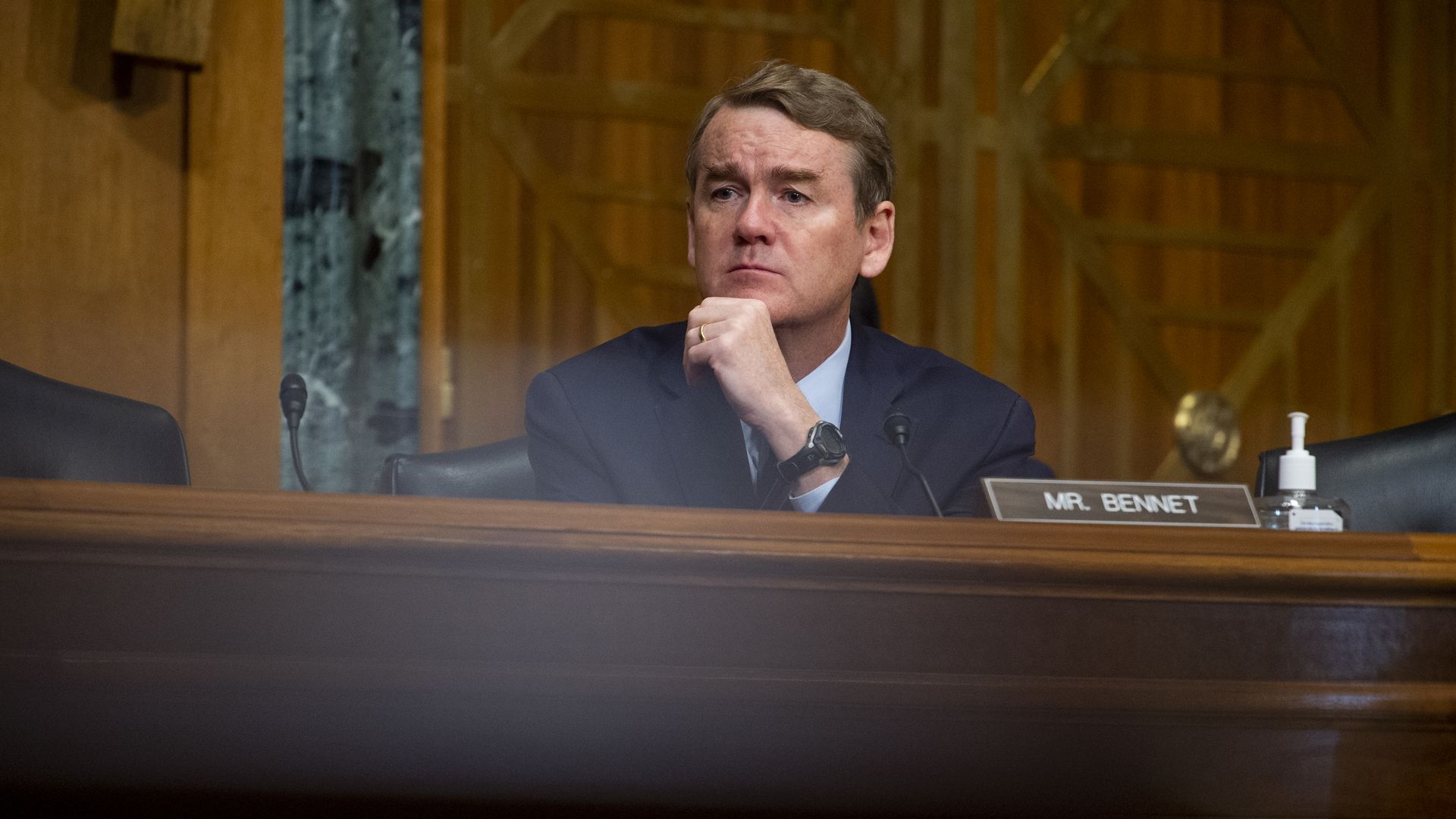 Sen. Michael Bennet is seen listening during a congressional hearing.