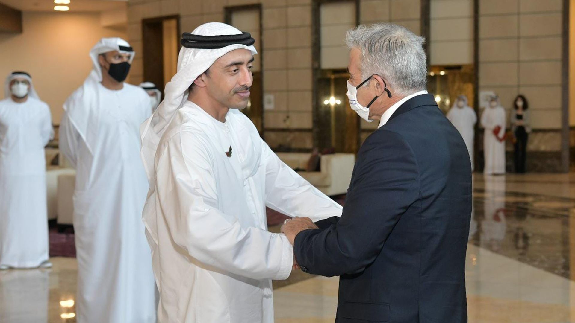 United Arab Emirates foreign minister Sheikh Abdullah bin Zayed shakes hands with Israeli foreign minister Yair Lapid