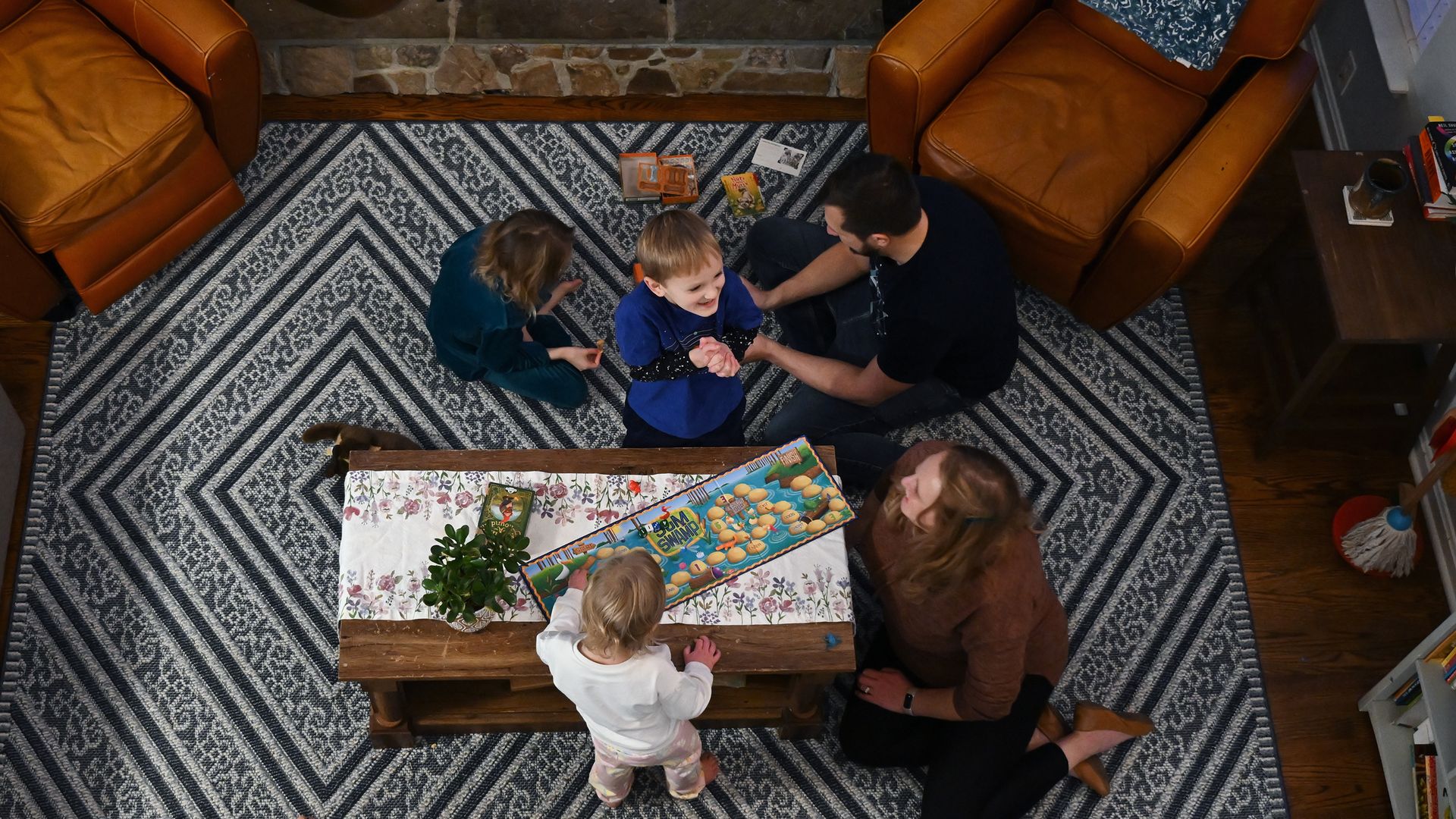 Family sitting together in living room.