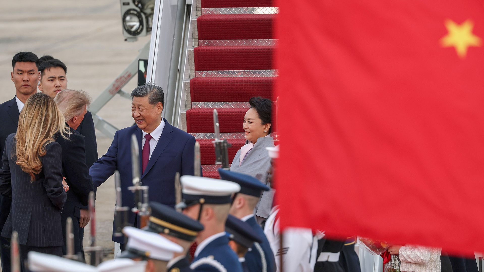 Donald Trump (L) greets Chinese President Xi Jinping (R) during an arrival ceremony on September 23, 2026 at Joint Base Andrews, Maryland