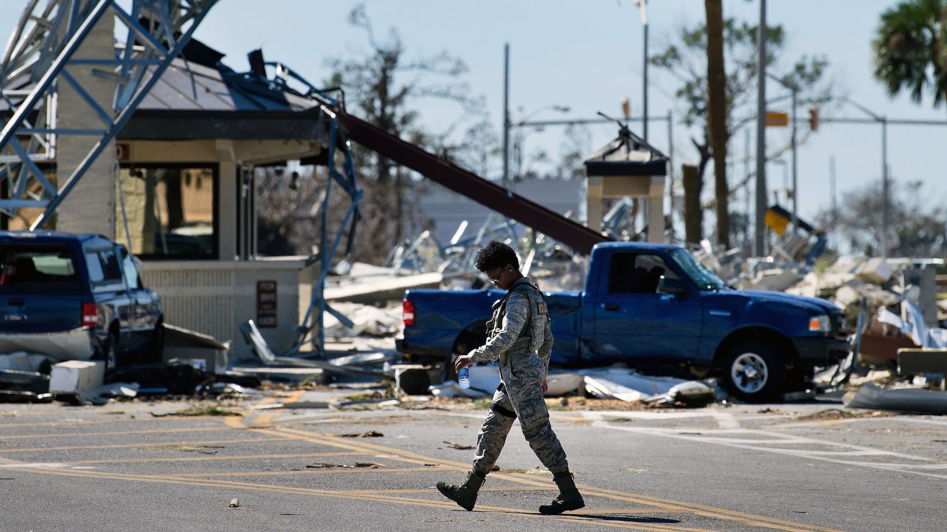 A military police officer patrols Tyndall Air Force Base in the wake of Hurricane Michael.