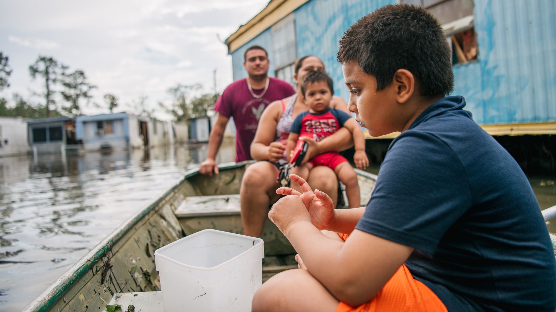 Photo of a family in a canoe on a river
