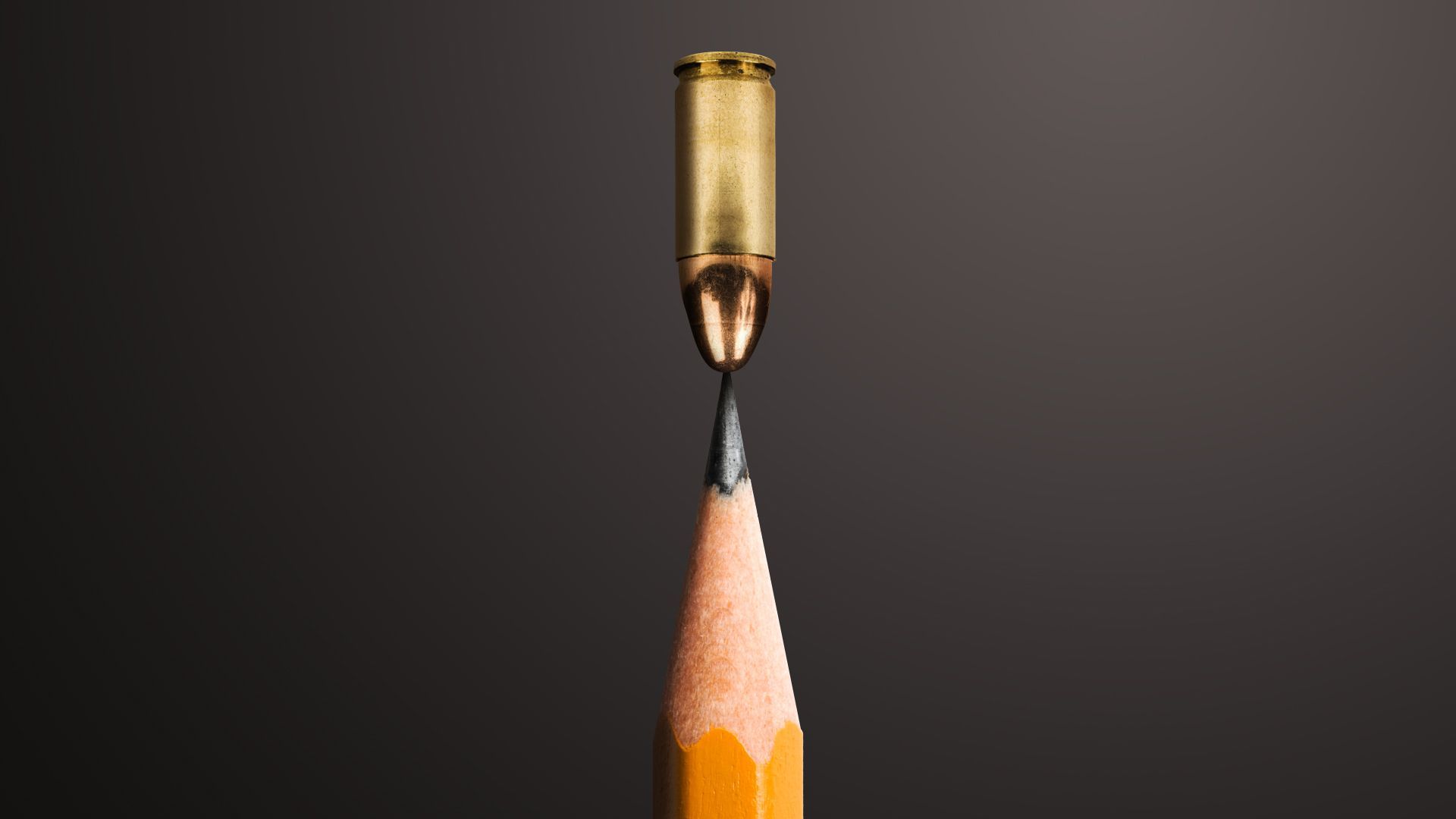 Illustration of a bullet balancing on the tip of a pencil