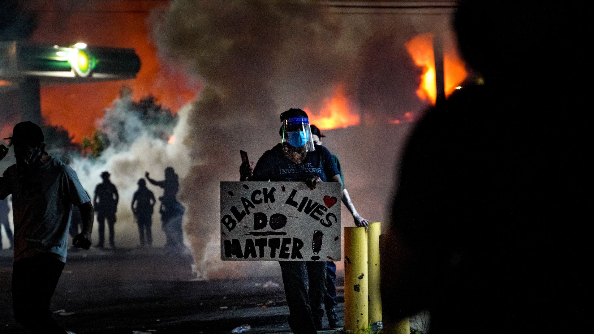 Demonstrators set on fire a restaurant during the protest after an Atlanta police officer shot and killed Rayshard Brooks, 27, at a Wendy's fast food restaurant drive-thy night in Atlanta