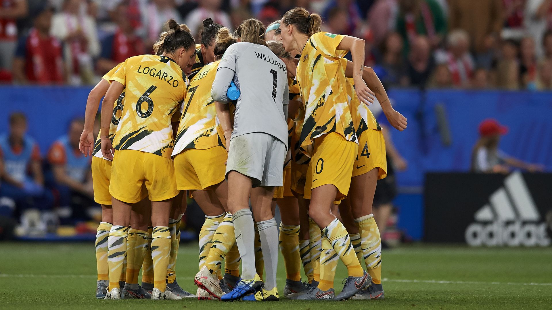 The Australian womens soccer team huddles before a match.