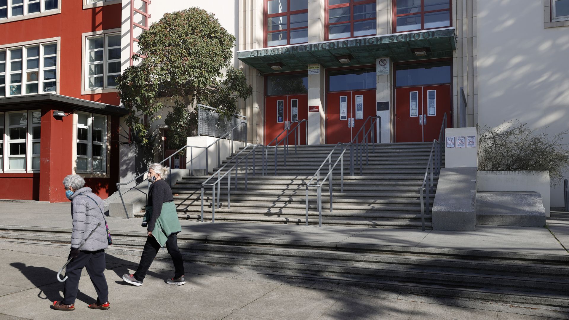 People walking past Abraham Lincoln High School in San Francisco in December 2020.