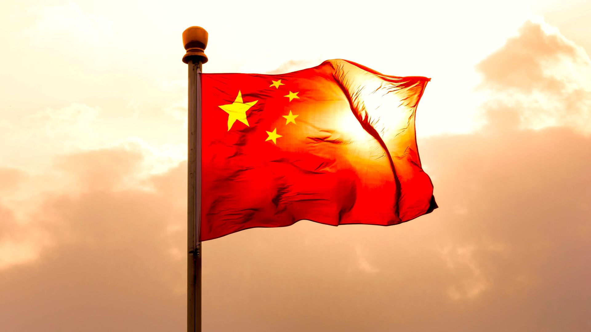 Photo of Chinese flag waving in sky