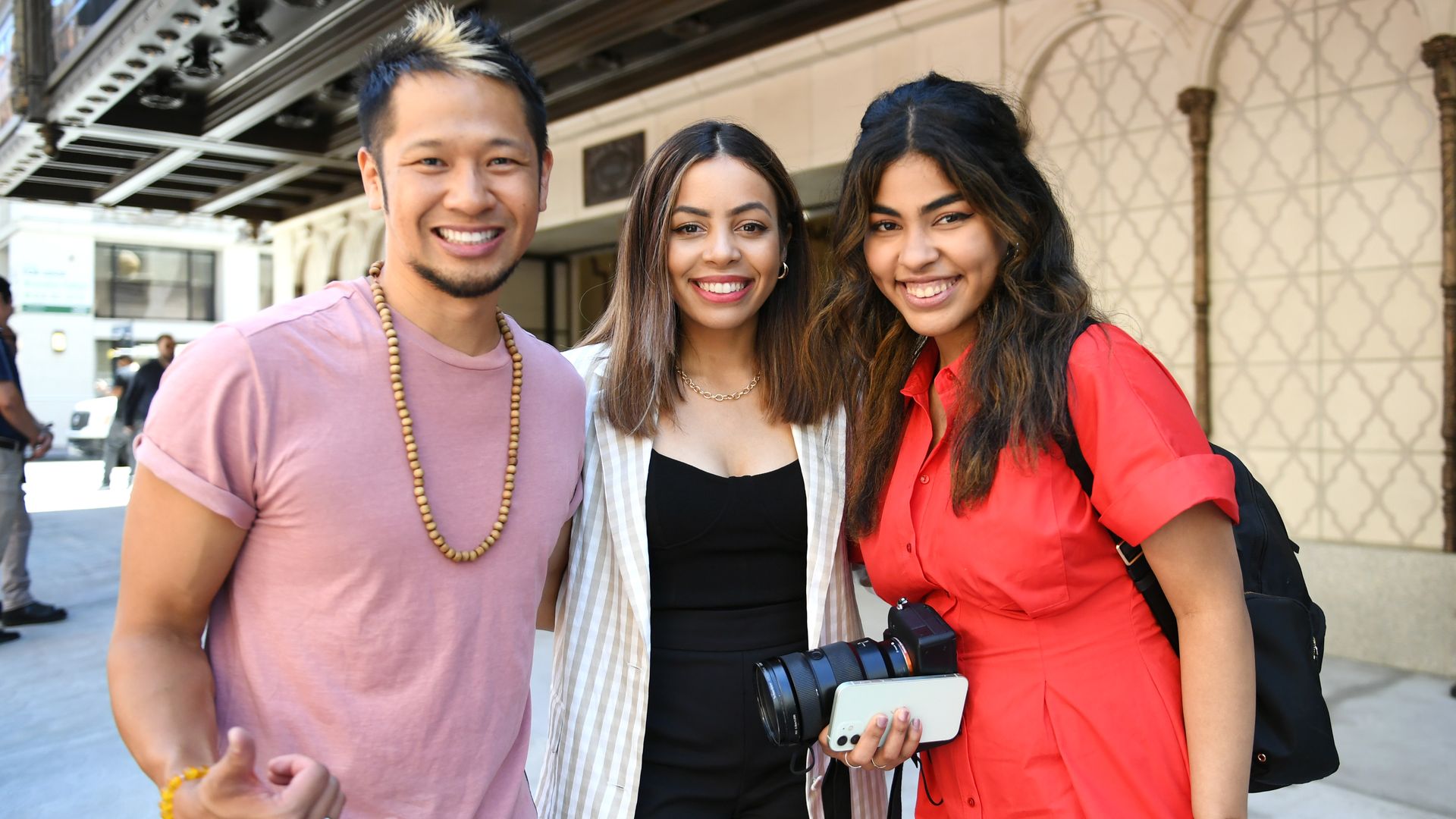 Brian Tong, Krystal Lora, and Gabriel Lora attend the opening of the new Apple Tower Theater retail store in Downtown Los Angeles.