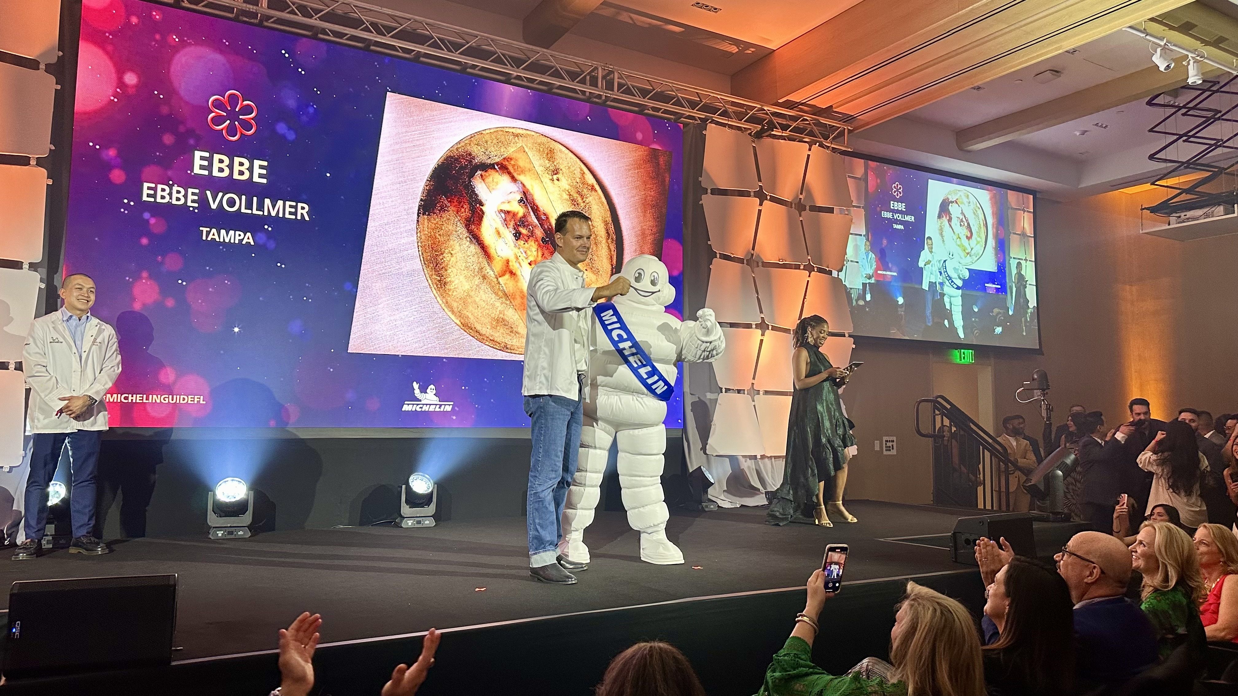 A Michelin mascot awards a prestigious star to Tampa's Ebbe restaurant. 
