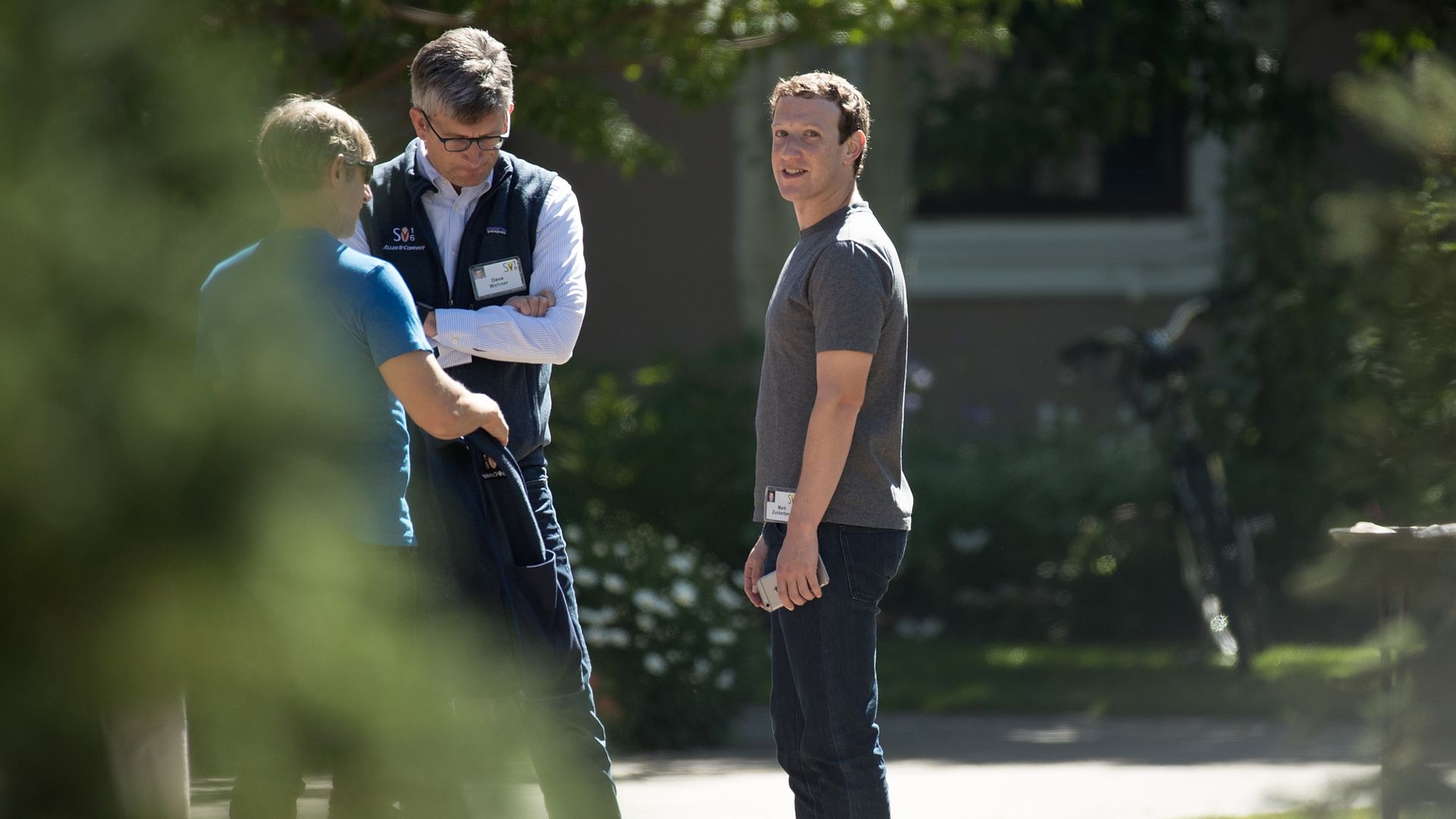 Mark Zuckberg stands with two other men