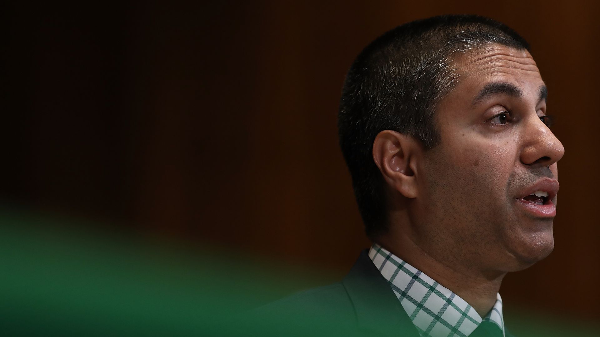 Ajit Pai speaks at a hearing
