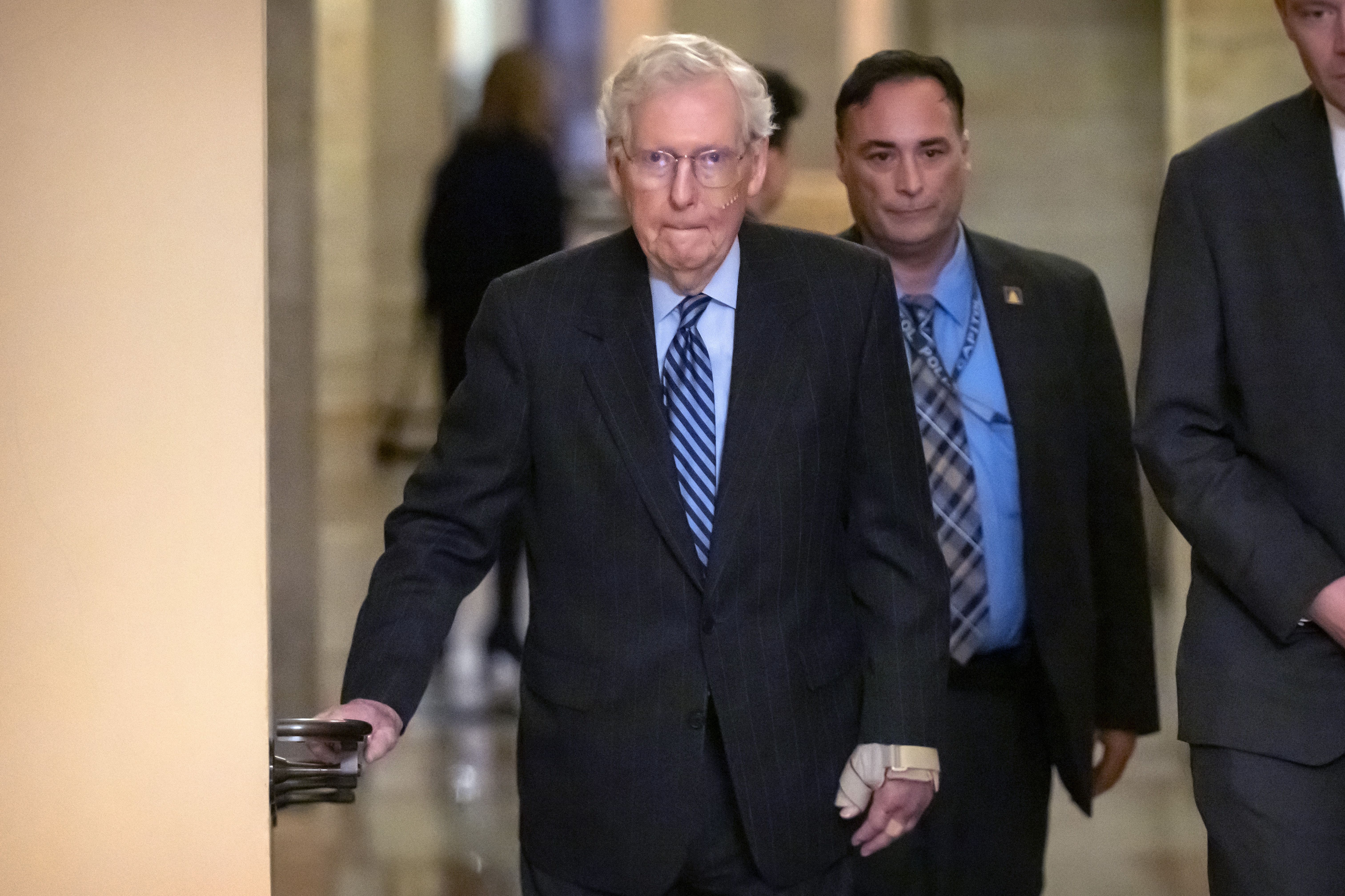  Senate Minority Leader Mitch McConnell (R-Ky.) walks to cast a vote on the Senate floor last week.