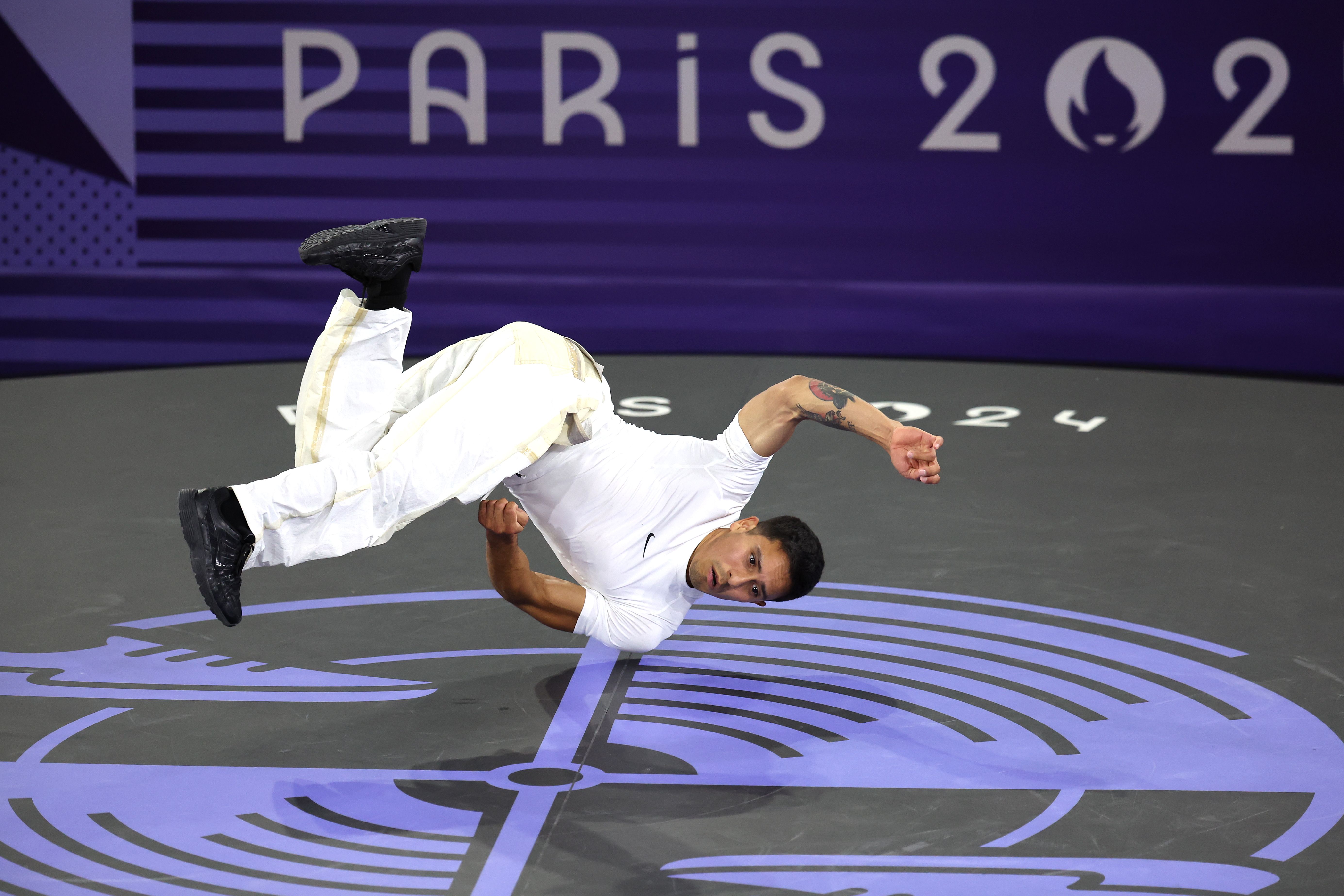 B-Boy Victor of Team United States competes with B-Boy Shigekix of Team Japan in the Breaking B-Boys Bronze Medal Battle on day fifteen of the Olympic Games Paris 2024 at Place de la Concorde on August 10, 2024 in Paris, France. (Photo by Steph Chambers/Getty Images)