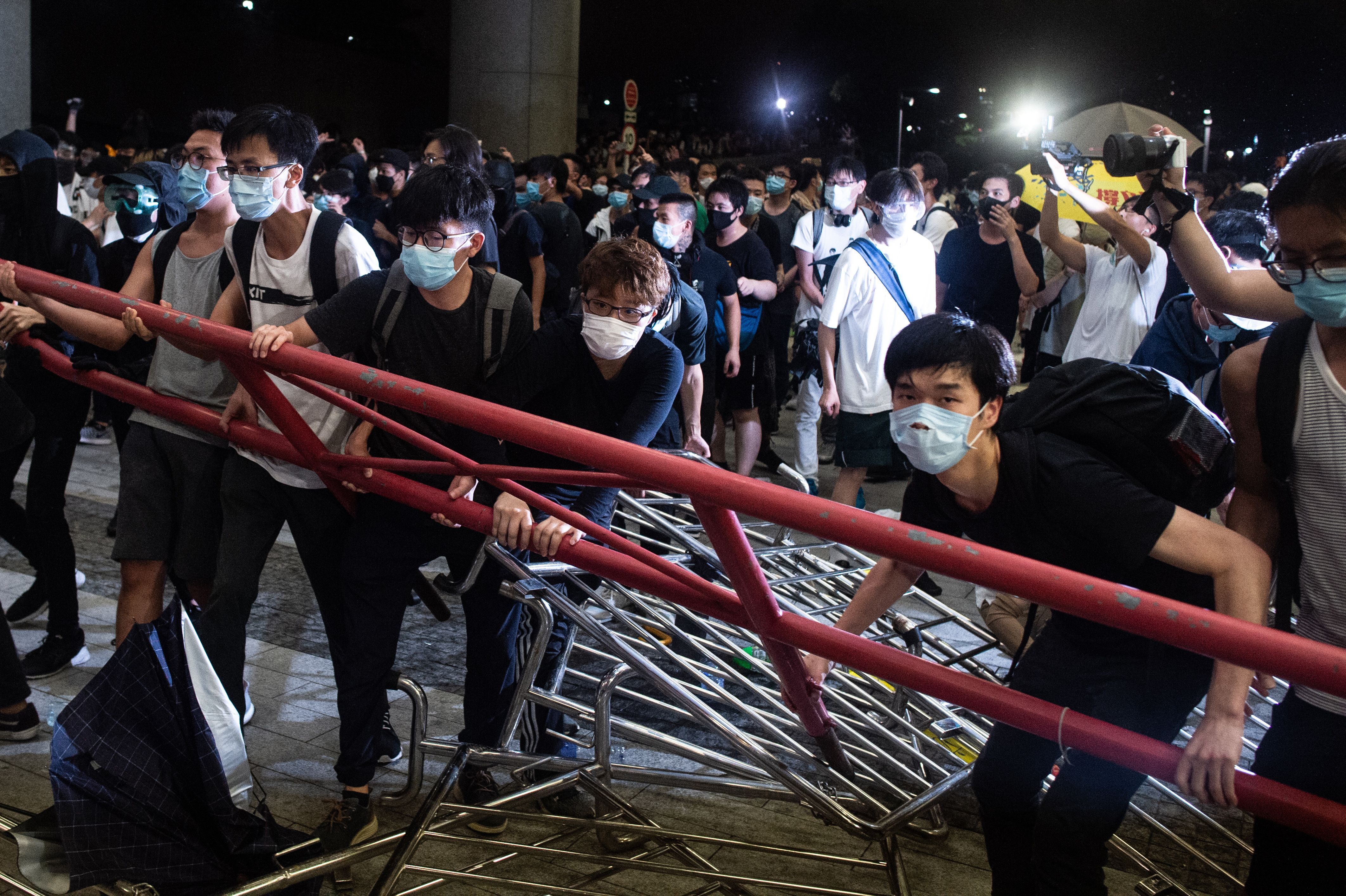 Protesters block the protest area of Legislative Council with barricades.