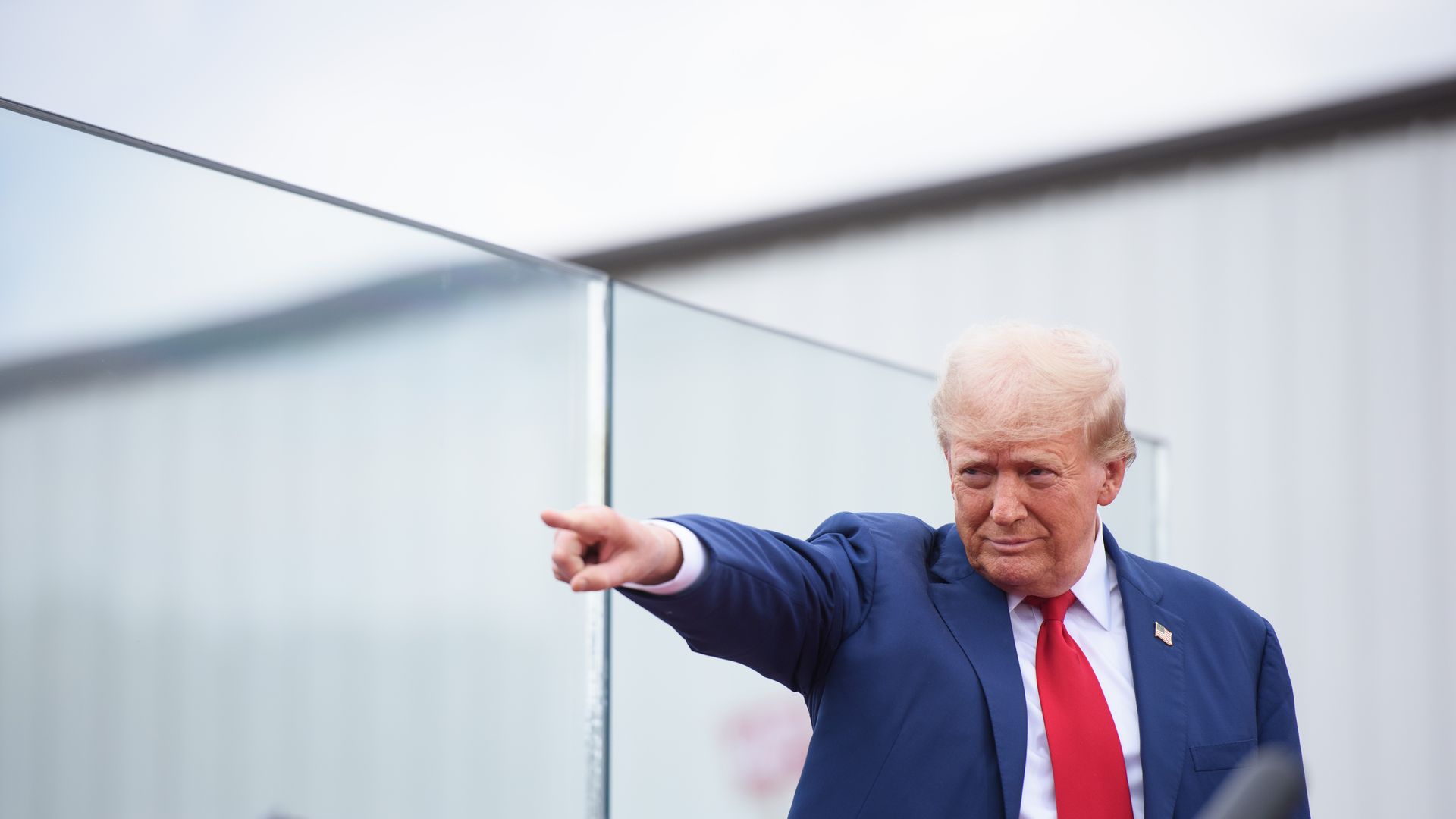 Trump points to the crowd at a campaign stop.