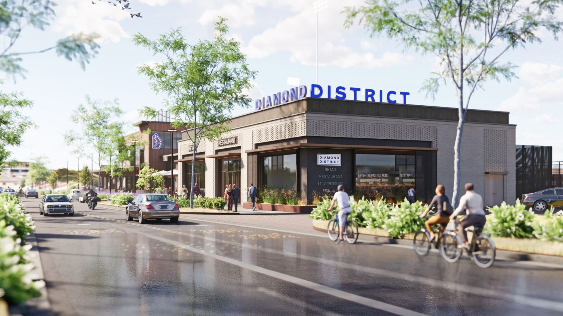 Street-level view of a modern shopping district building with a large blue "DIAMOND DISTRICT" sign, glass storefronts, pedestrians, cyclists, and cars on a tree-lined street under a bright sky.