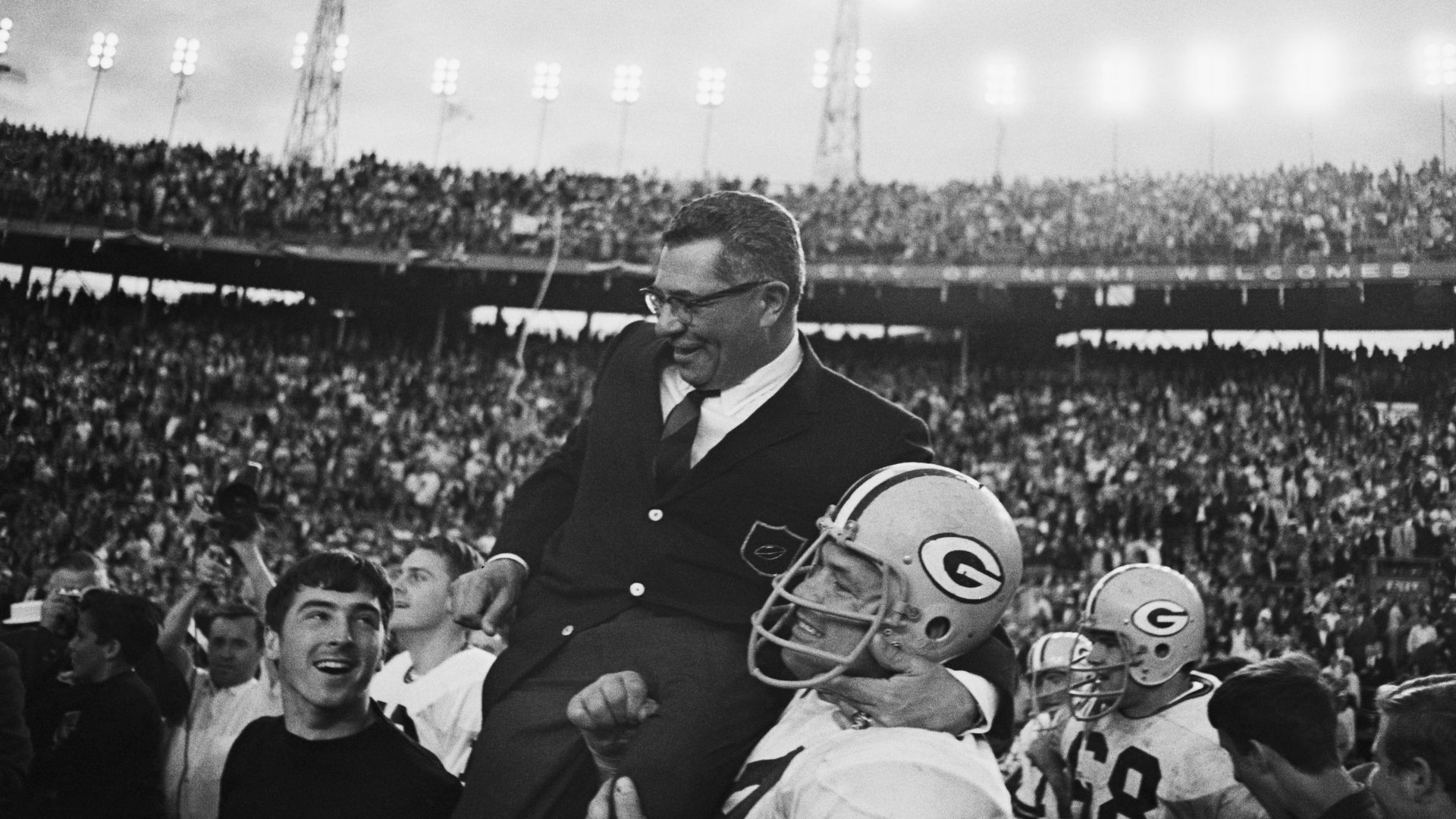 Vince Lombardi being carried off by his players