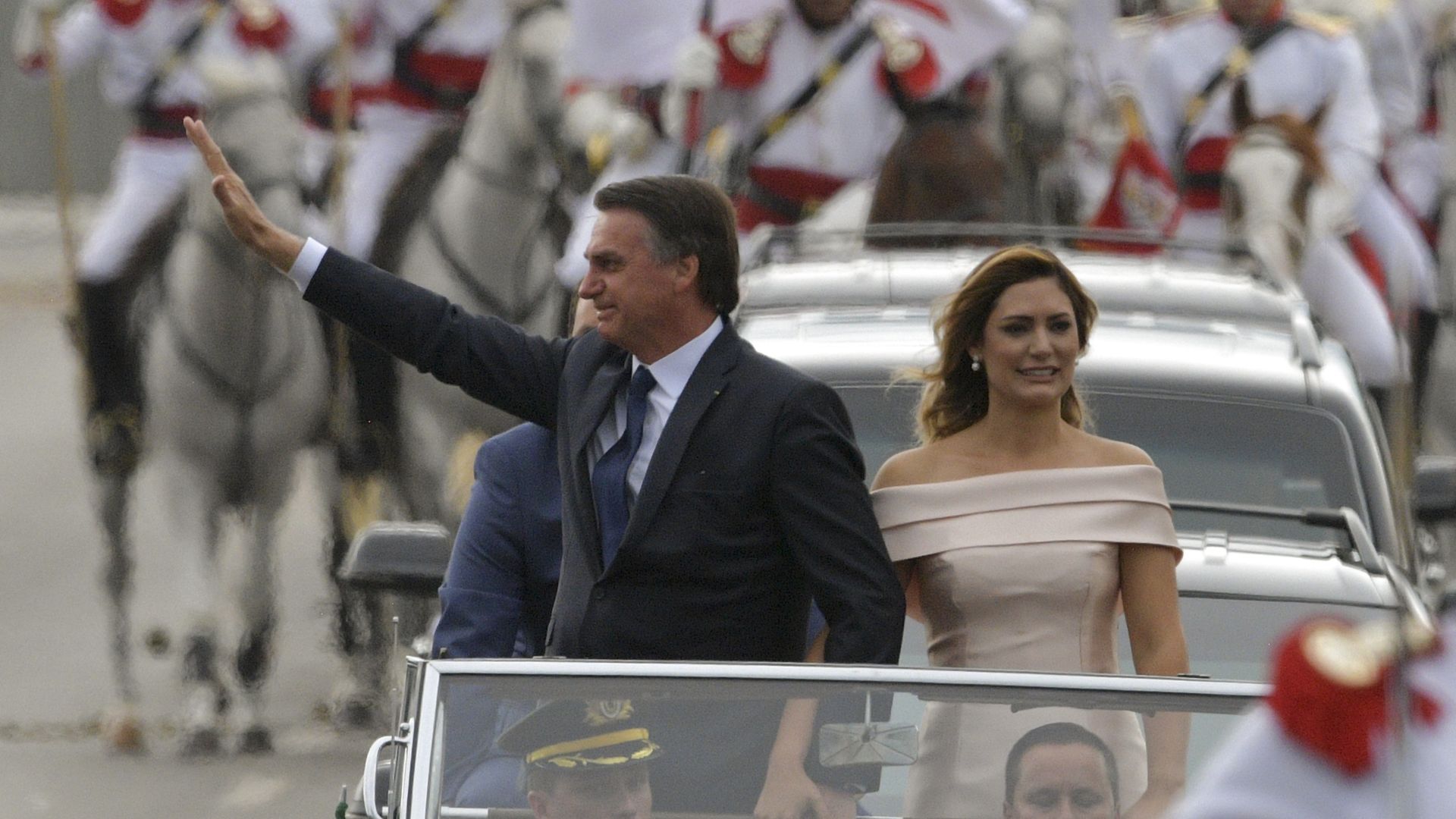 Bonasaro waving in a parade ahead of inauguration