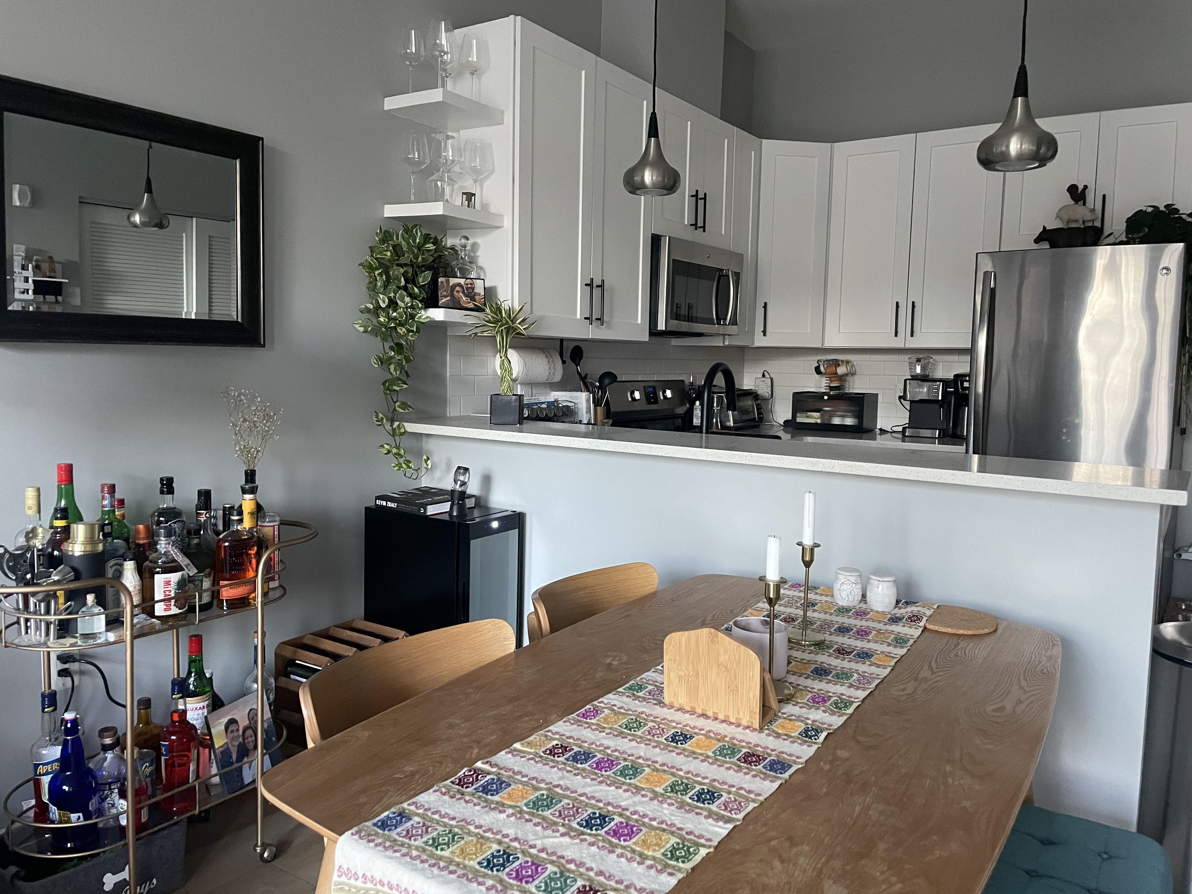 A cozy dining area and kitchen inside a D.C. condo.