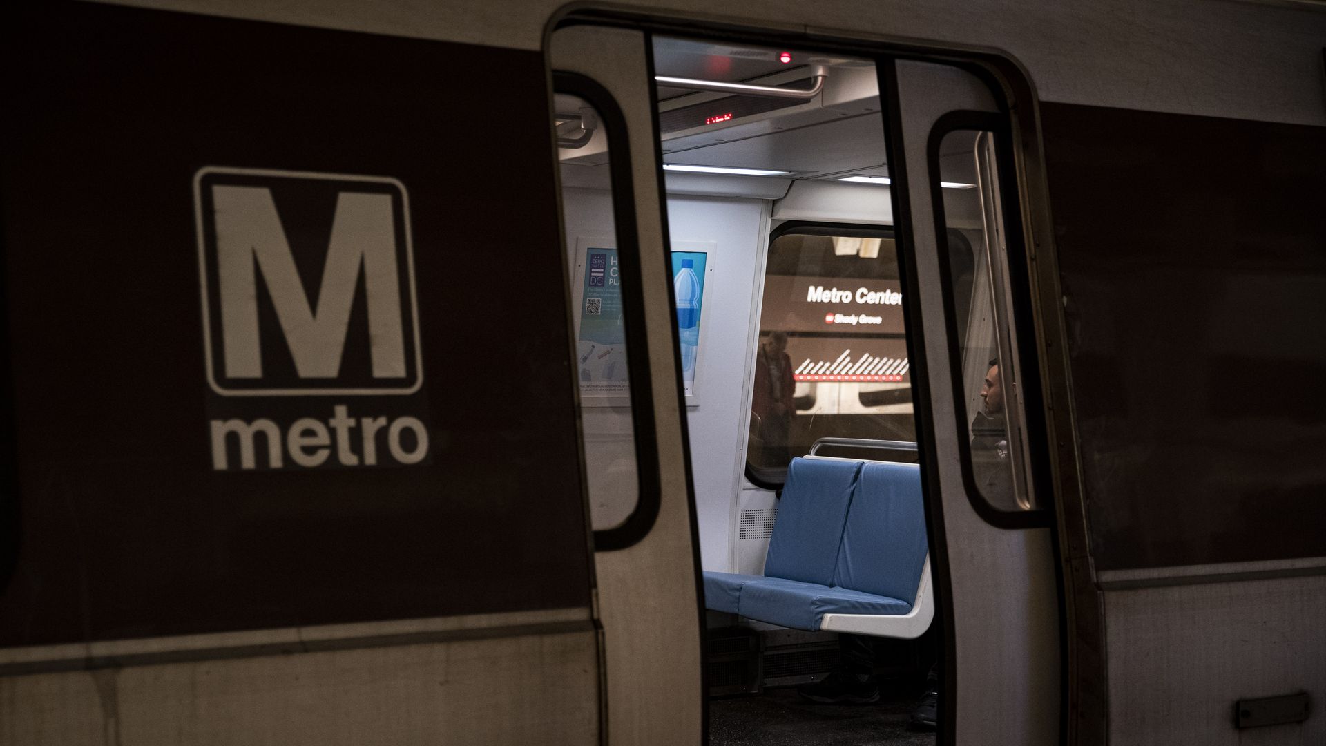 A door on a Metro car in Washington, D.C., is half-open, showing the interior.