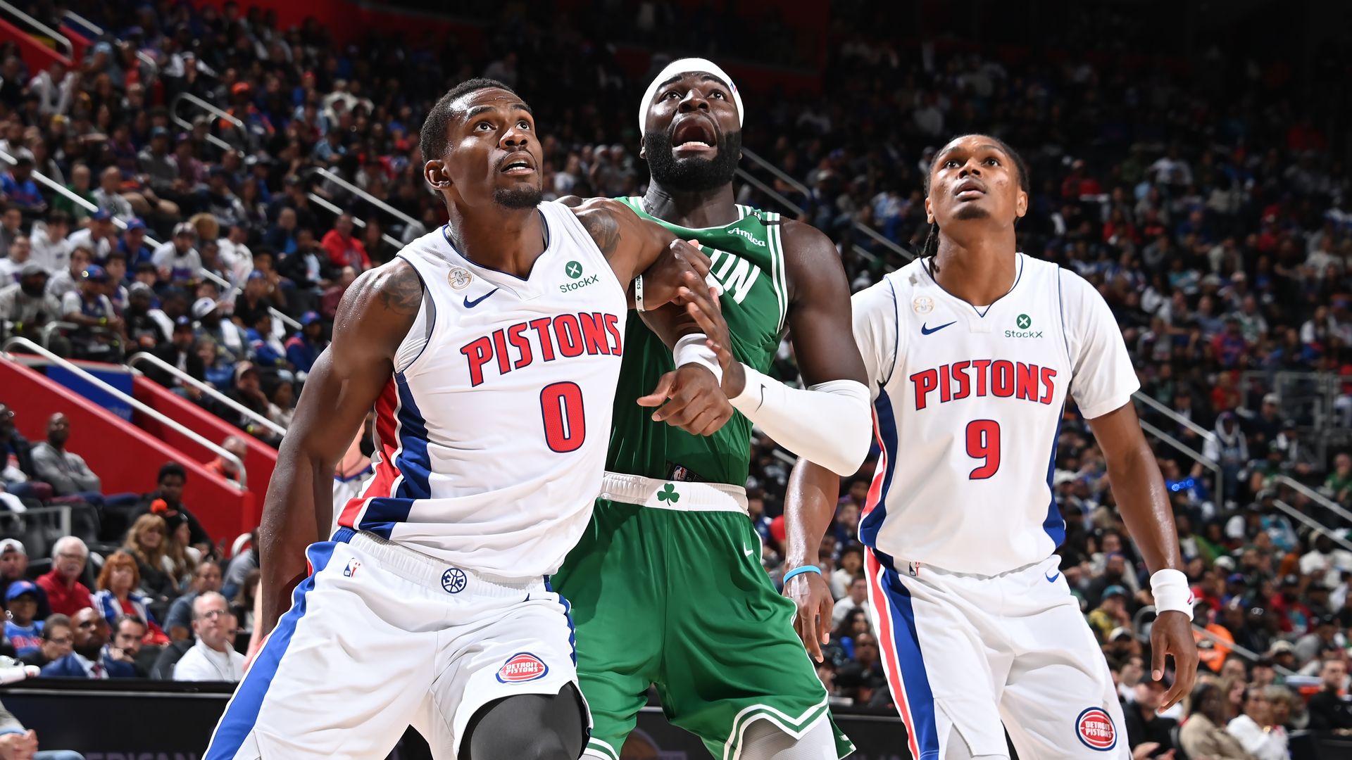 Jalen Duren and the Celtics' Neemias Queta battle for position. 